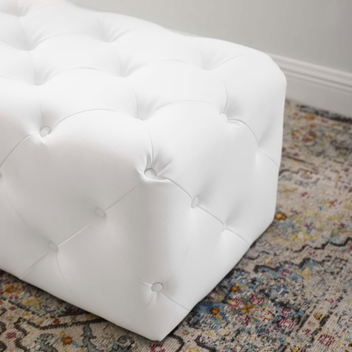 Supple faux leather and neatly tailored tufting deliver a refined, cushioned finish || EEI-3767-WHI || detail_room