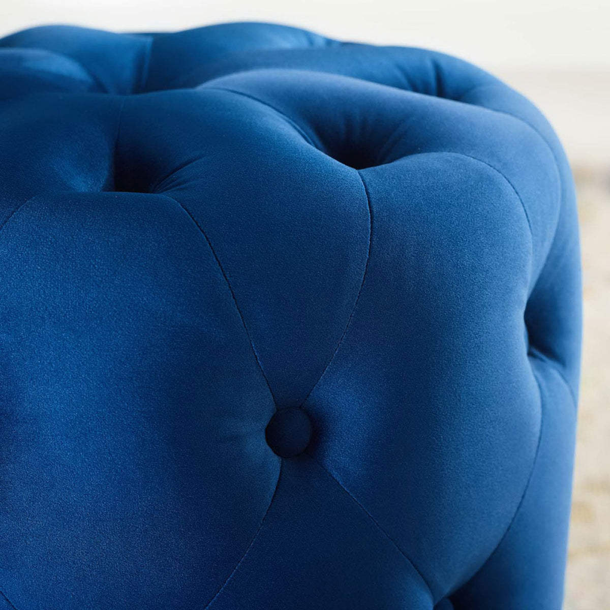 Navy velvet tufting with gentle sheen that adds a luxe accent atop a light patterned rug || EEI-3778-NAV || detail_room