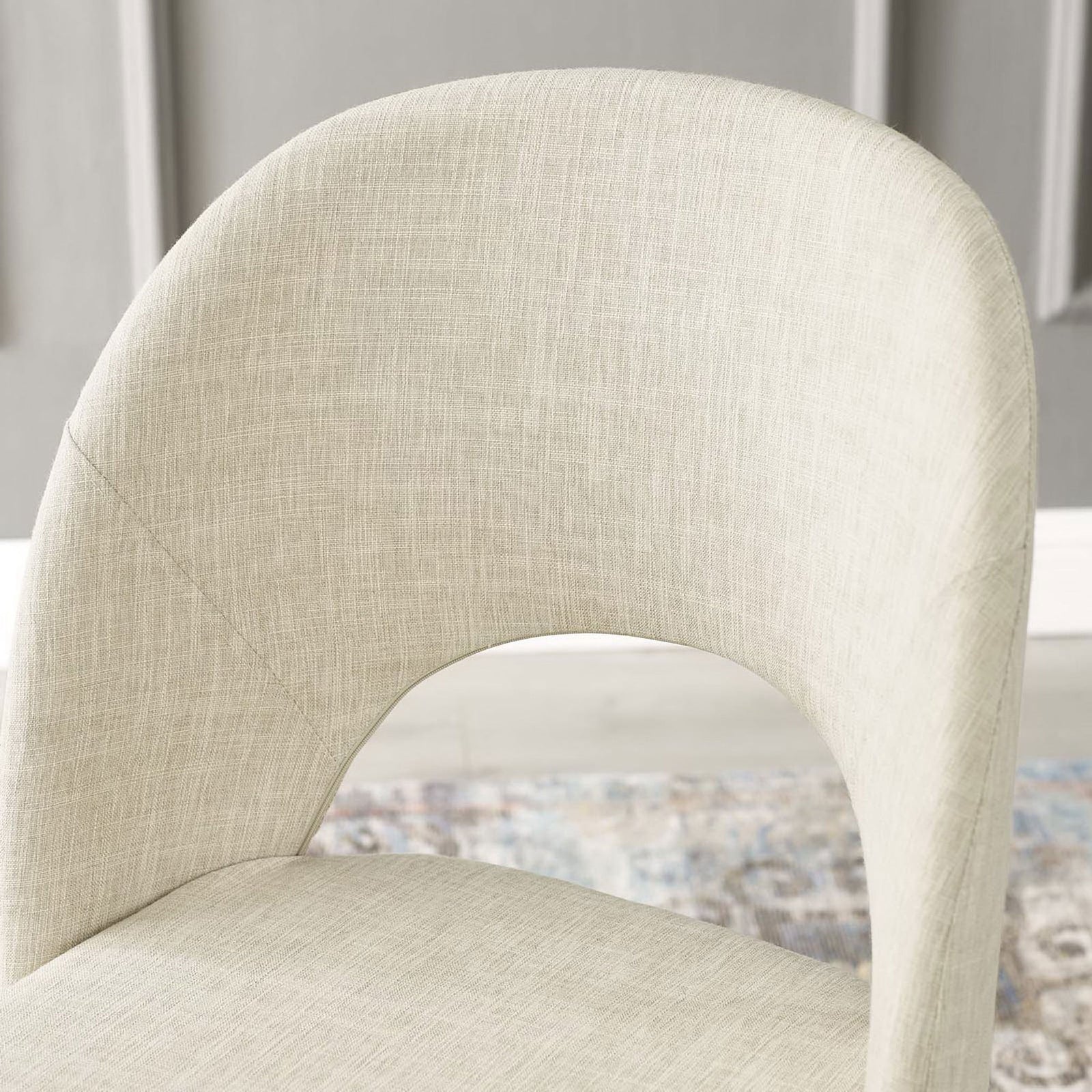 Curved upholstered back with cutout detail adds softness and shape against the paneled wall || EEI-3801-BLK-BEI || detail_room