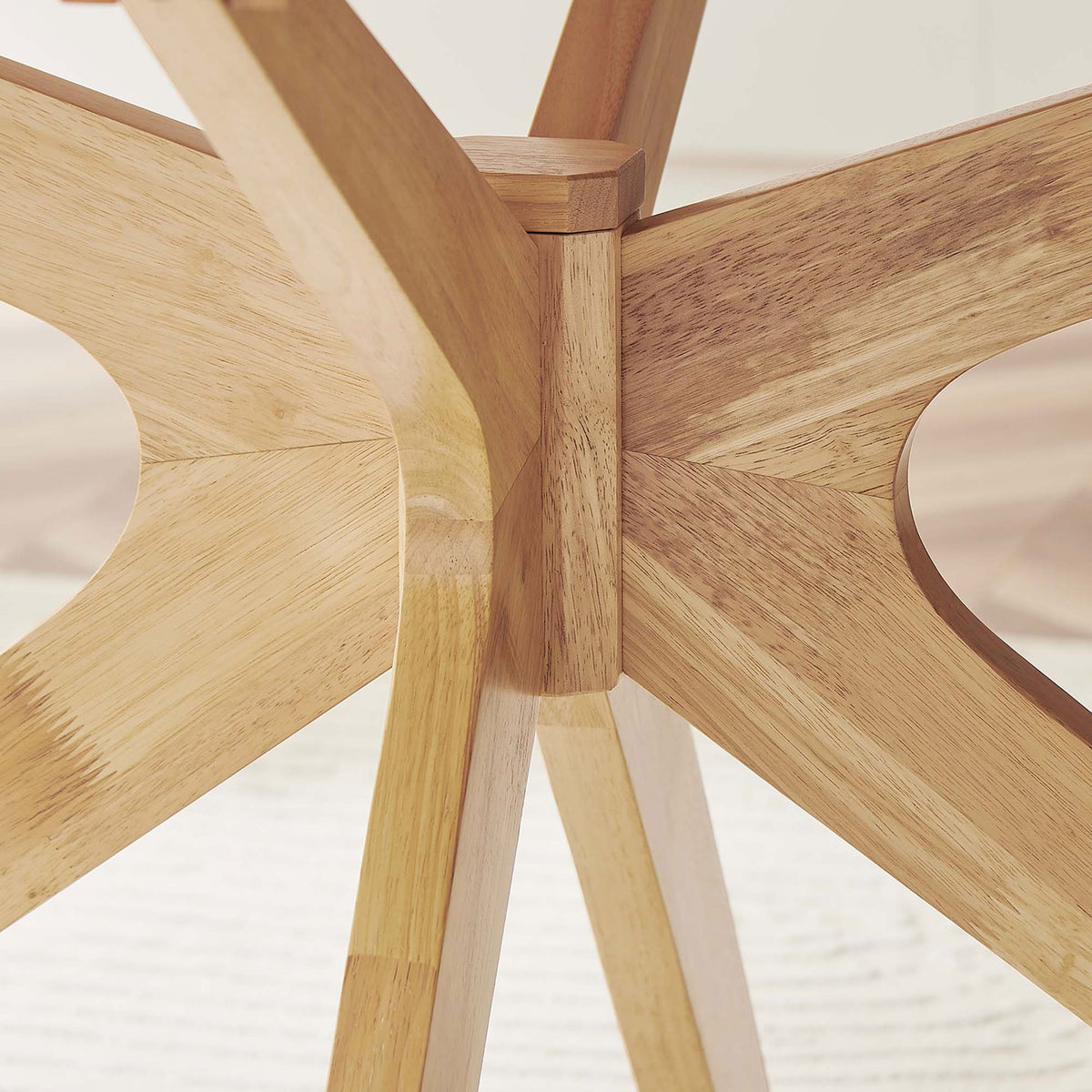 Intersecting oak supports and smooth joinery at the center of the 63-inch dining table base. || EEI-3848-OAK || detail_room