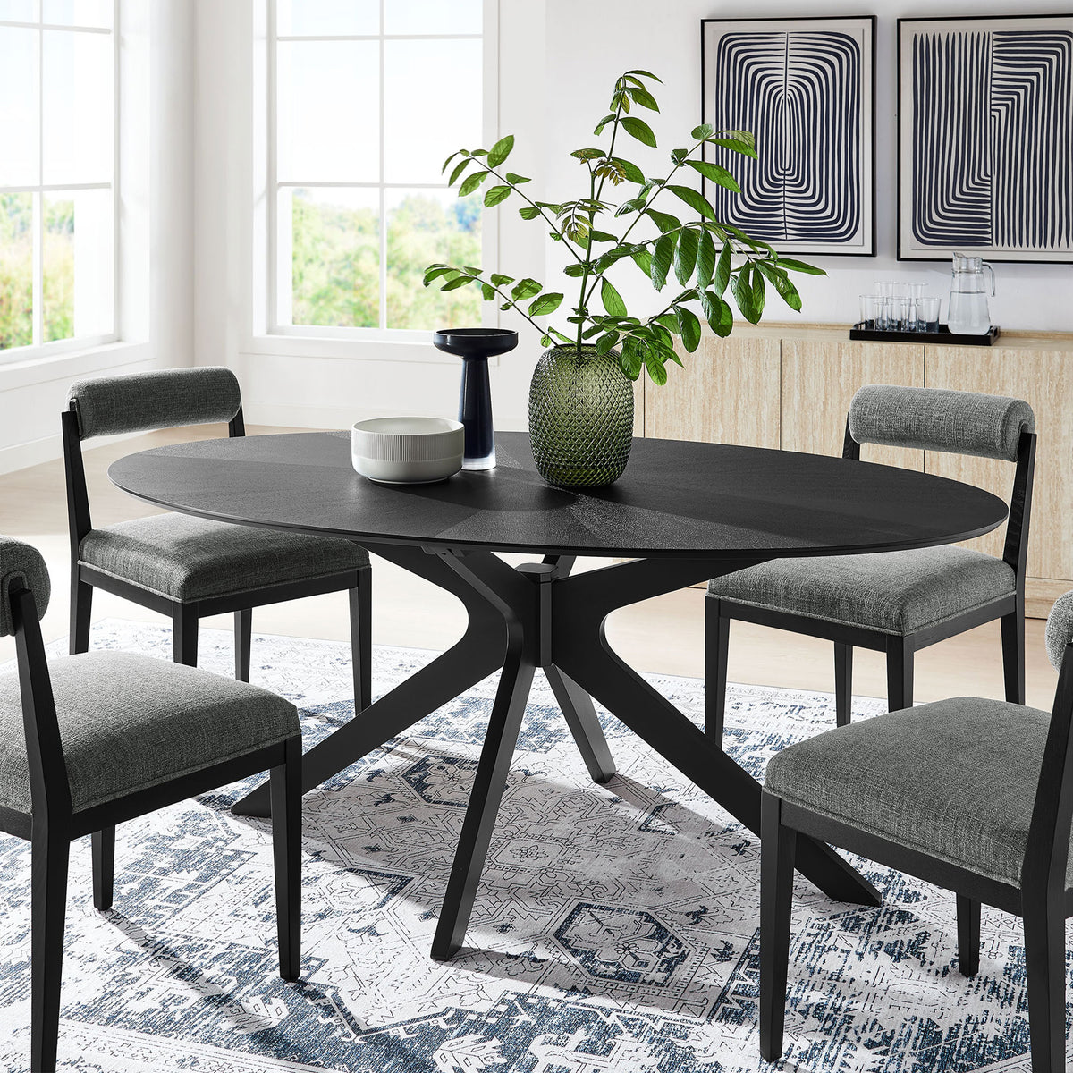 Black oval dining table arranged in a modern dining room with gray chairs and geometric art || EEI-3849-BLK || front_angle_room