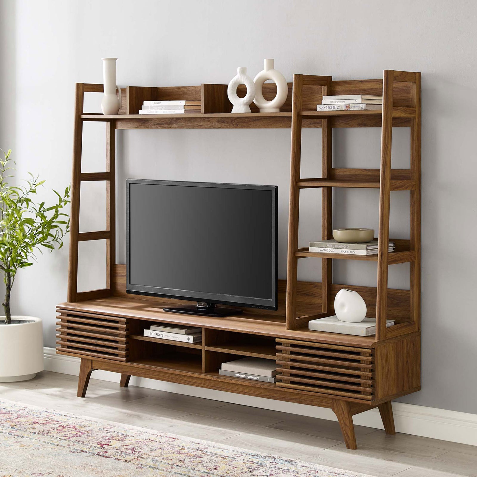 Walnut entertainment center styled in a modern living room with TV, decor, and spacious tiered shelving || EEI-3863-WAL || front_angle_room