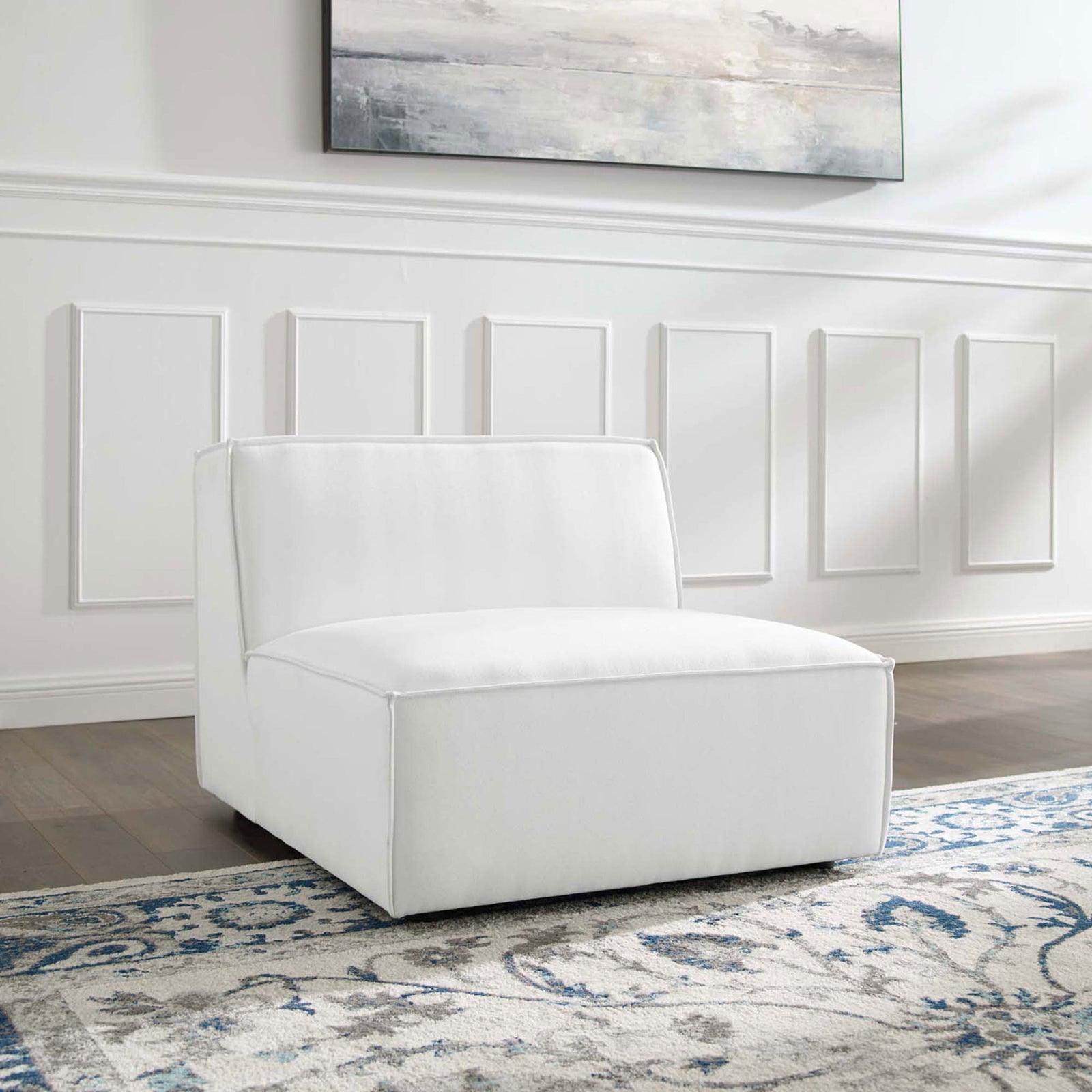 Minimalist white armless chair anchors the living room with plush comfort and clean-lined modern design || EEI-3872-WHI || front_angle_room