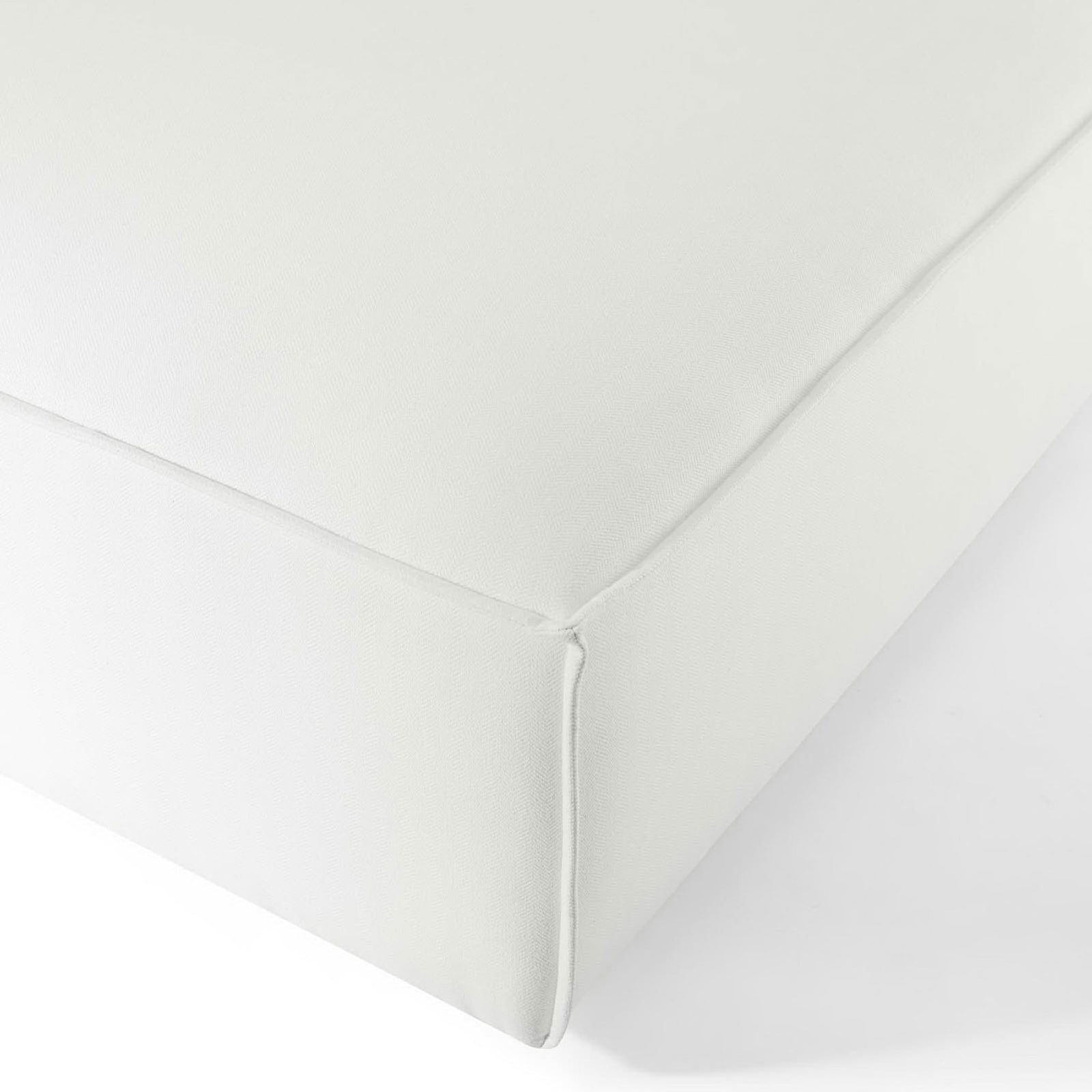 Corner of white woven fabric cushion showing crisp stitching detail on the Restore ottoman || EEI-3873-WHI || detail_studio
