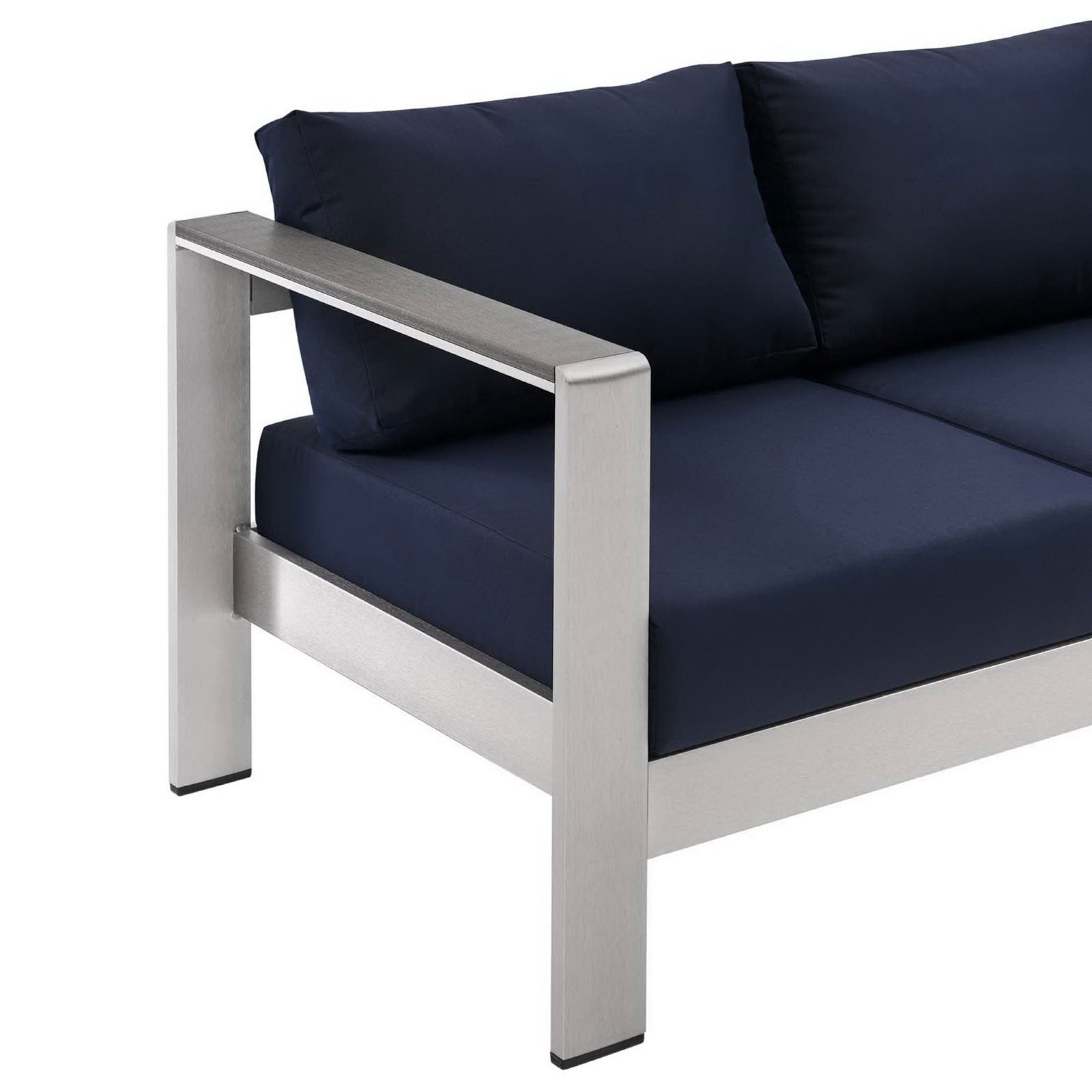 Wide metal armrest contrasts with smooth navy cushions for a refined outdoor seating look || EEI-3917-SLV-NAV || detail_studio