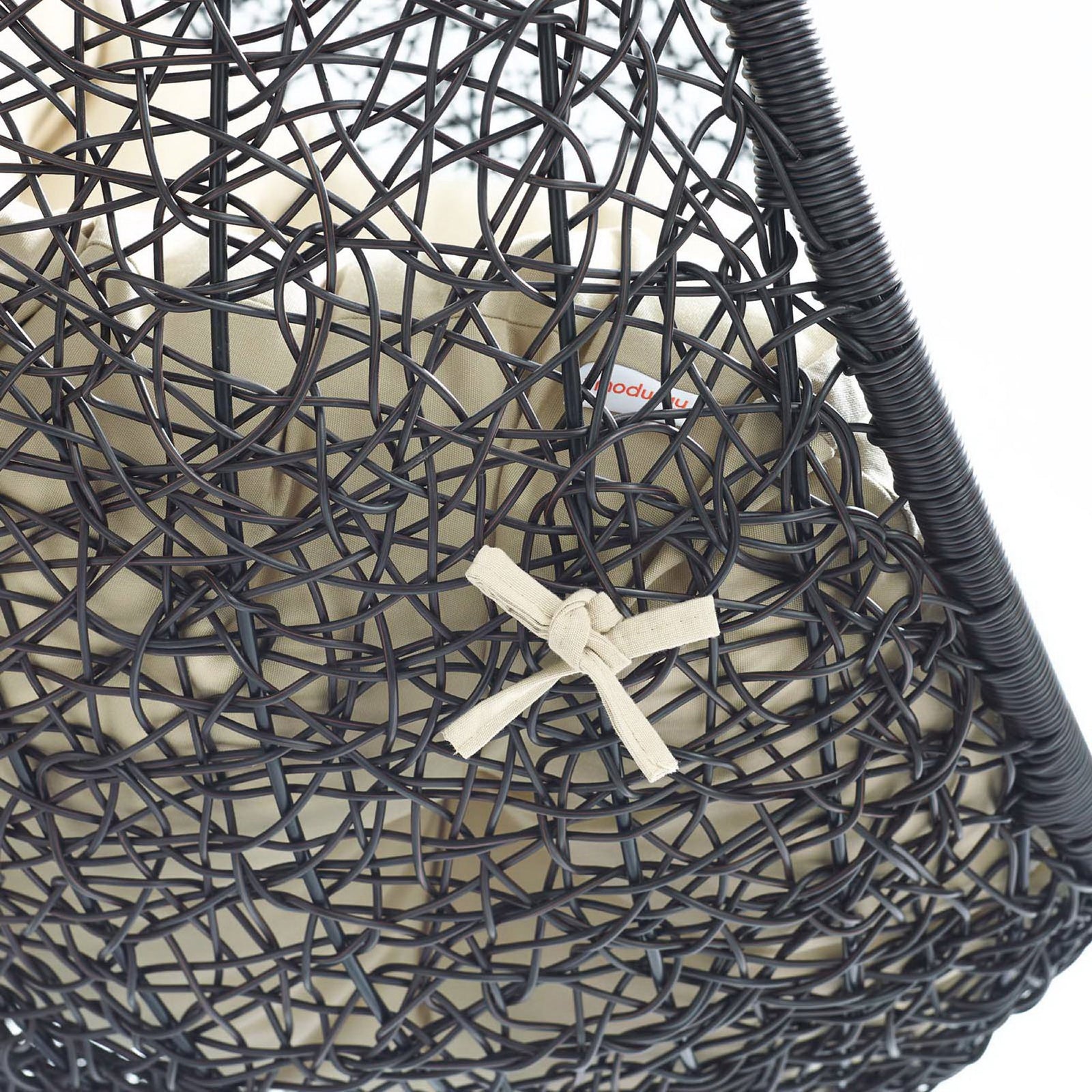 Close-up of dark rattan weave and beige cushion ties showcasing durable outdoor craftsmanship || EEI-3943-BLK-BEI || detail_studio