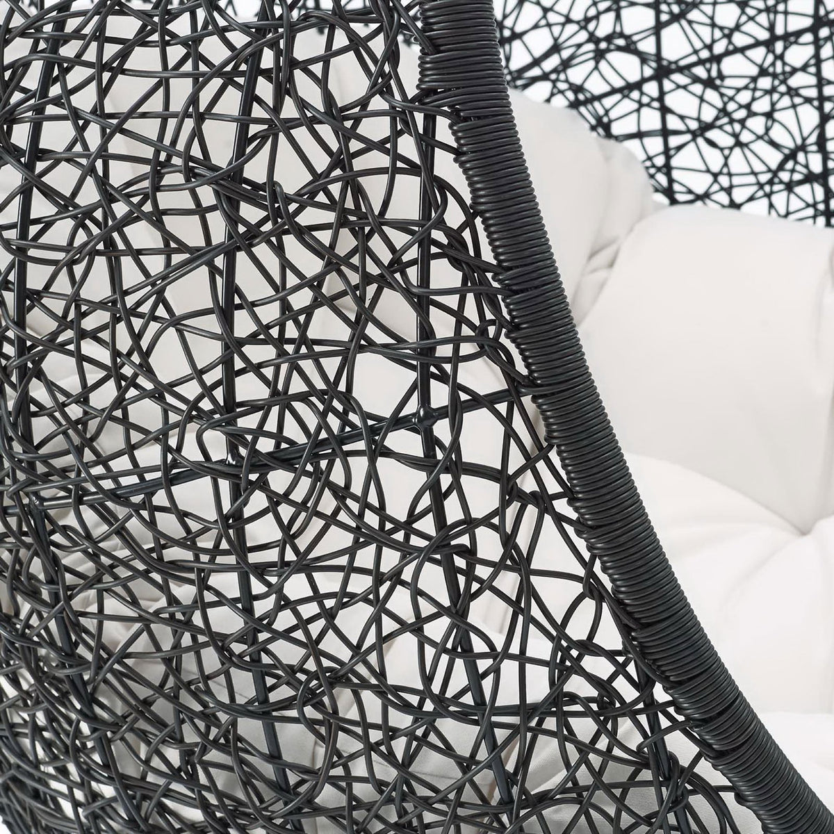 Close-up of dark rattan frame texture and white cushion showing durable outdoor construction || EEI-3943-BLK-WHI || detail_studio