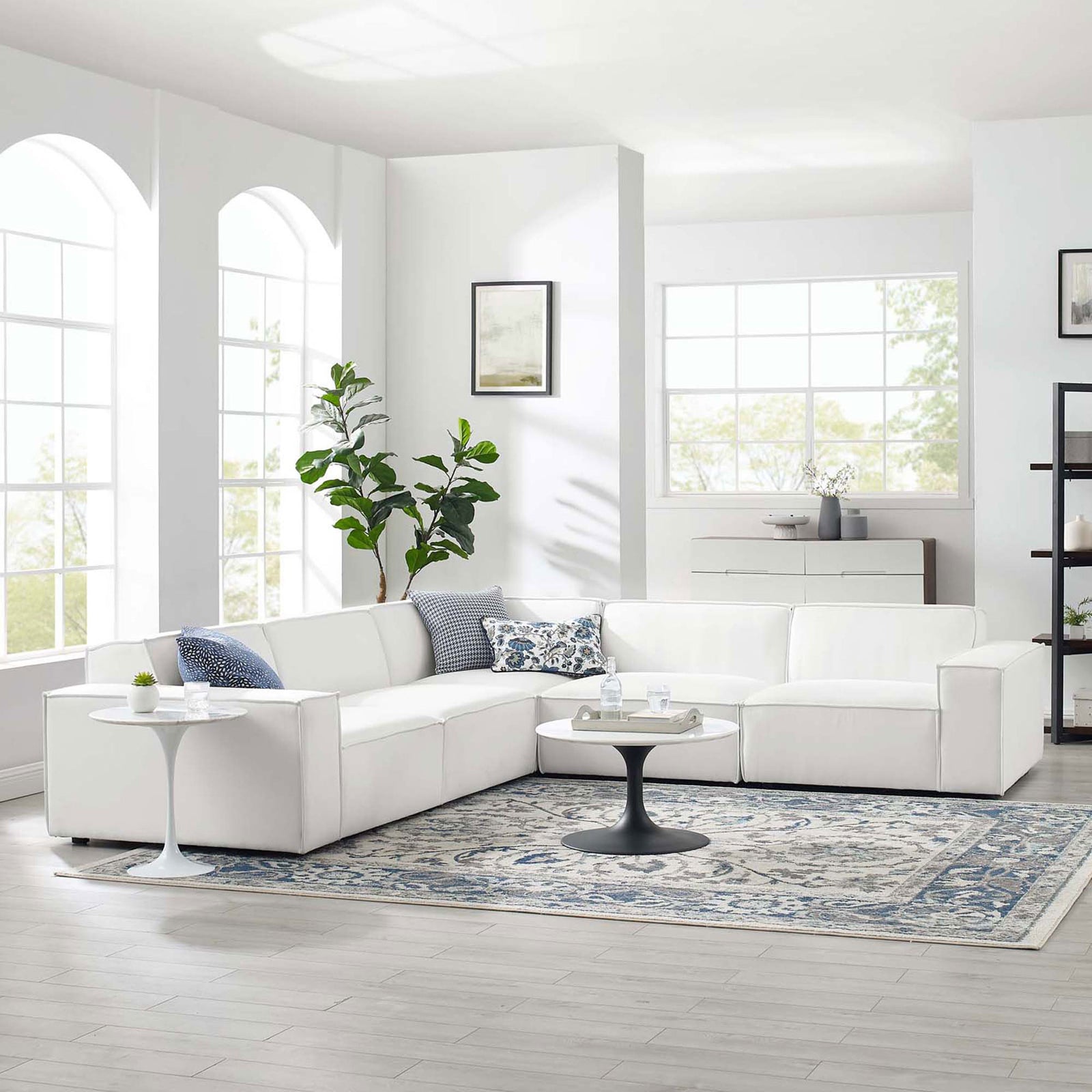 White 5-piece sectional sofa styled in a bright living room with rug, tables, and pillows || EEI-4117-WHI || front_angle_room