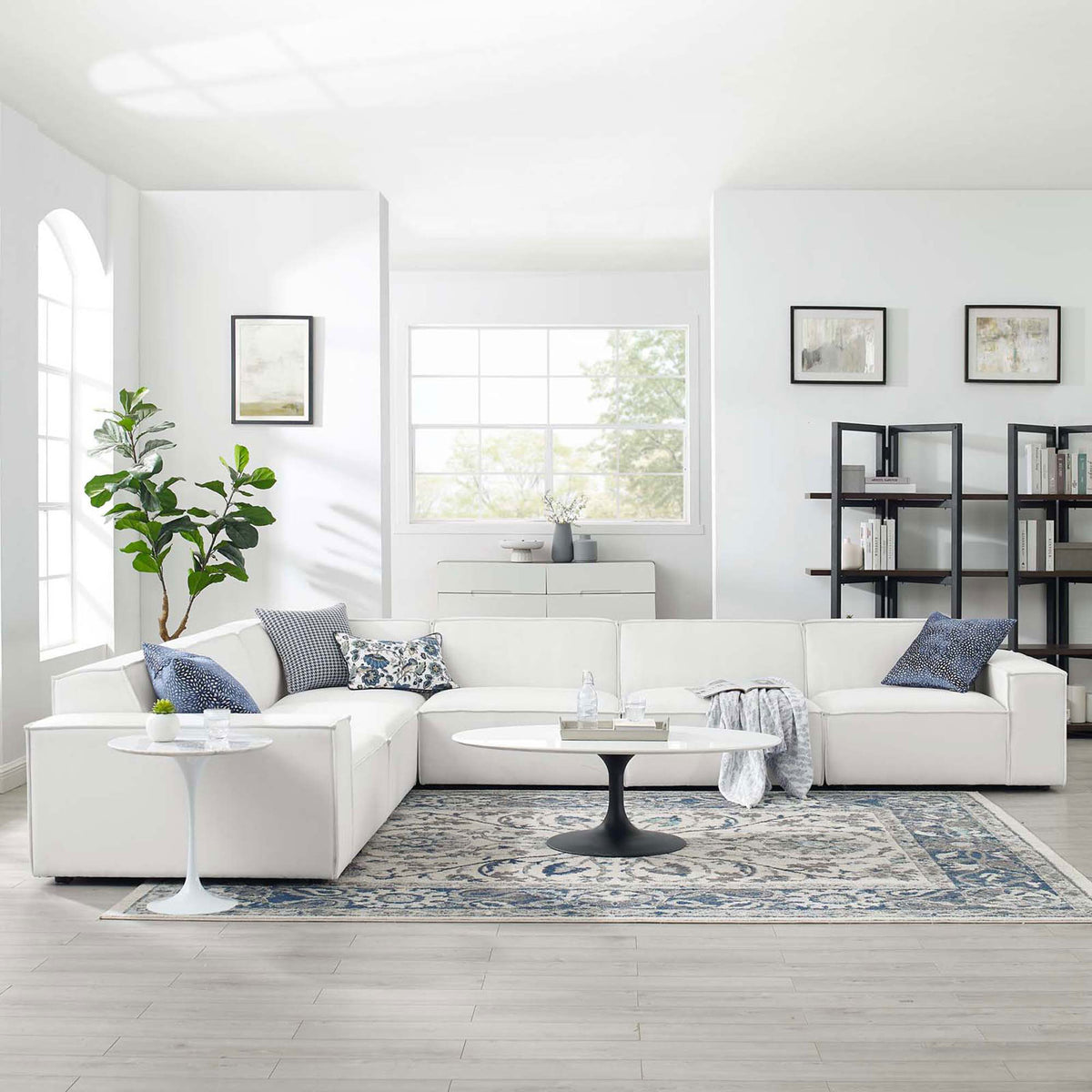 Bright living room featuring the white Restore modular sectional styled with accent pillows and modern decor || EEI-4119-WHI || front_angle_room