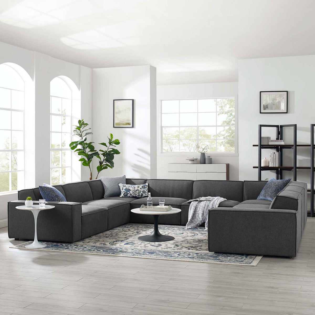 Charcoal u-shaped modular sectional styled in an airy living room for relaxed entertaining || EEI-4121-CHA || front_angle_room
