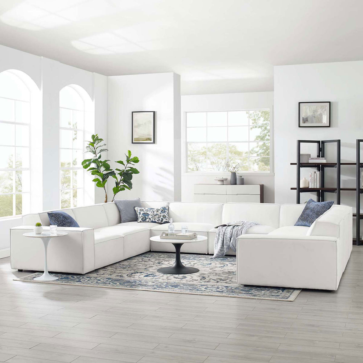 White Restore 8-piece modular sectional arranged in a bright living room with rug and tables || EEI-4121-WHI || front_angle_room