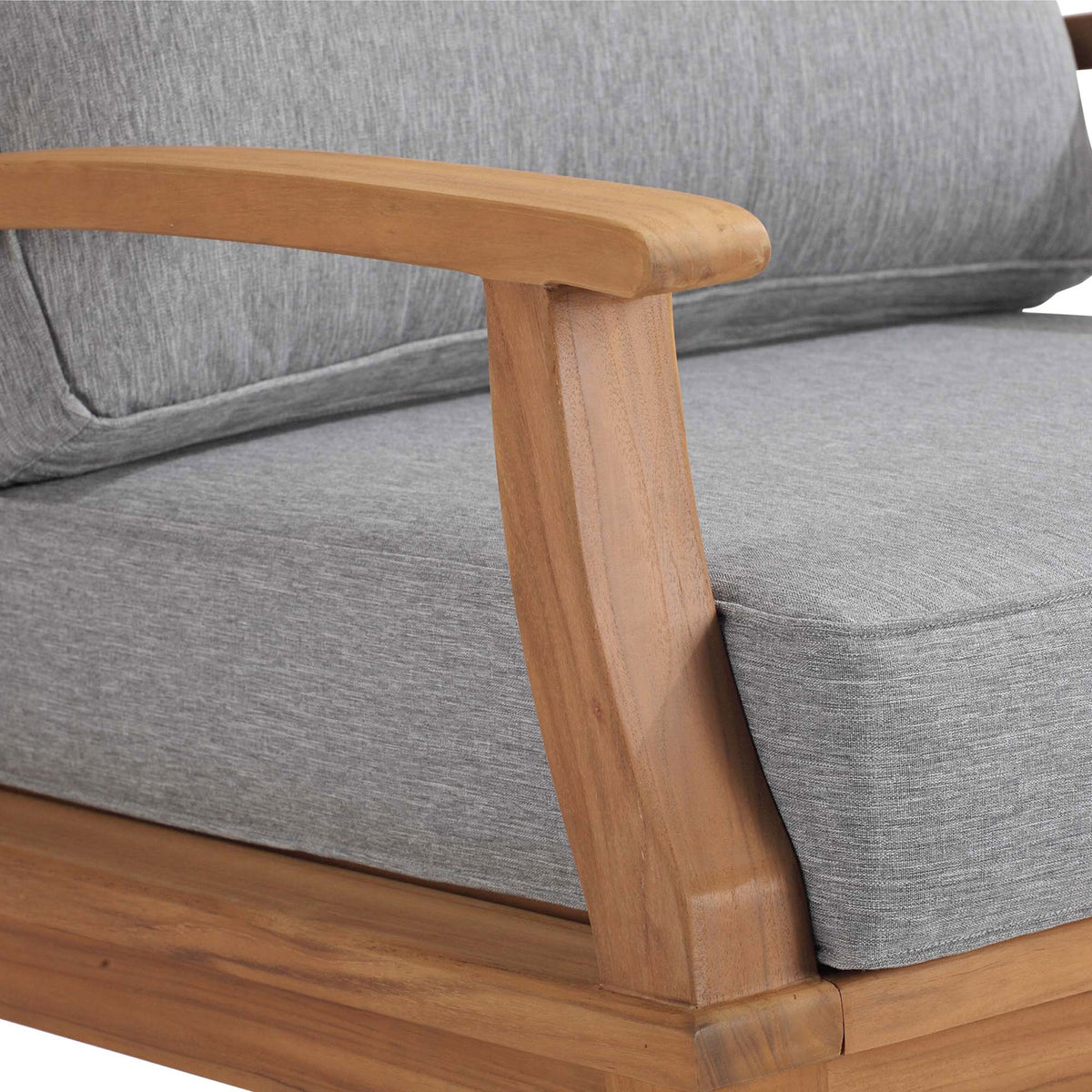Close up of Marina rocking chair armrest highlighting smooth teak finish and tailored gray upholstery || EEI-4177-NAT-GRY || detail_studio