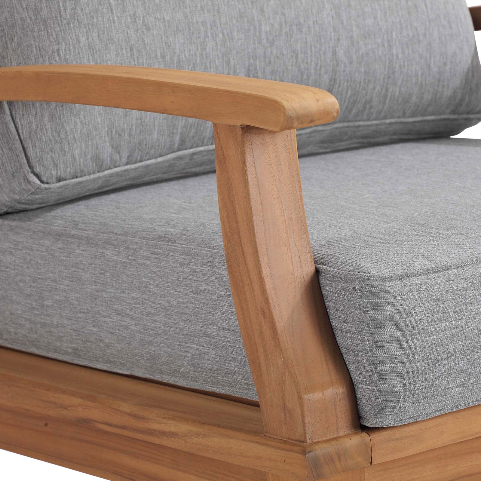 Close up of Marina rocking chair armrest highlighting smooth teak finish and tailored gray upholstery || EEI-4177-NAT-GRY || detail_studio
