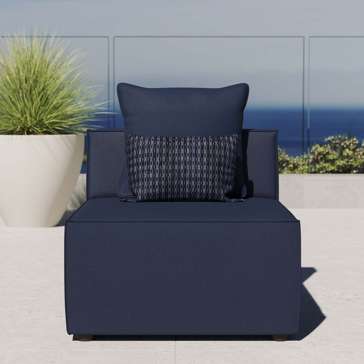 Navy blue outdoor armless sectional chair styled on a bright patio with ocean view and plush cushion comfort || EEI-4209-NAV || front_room