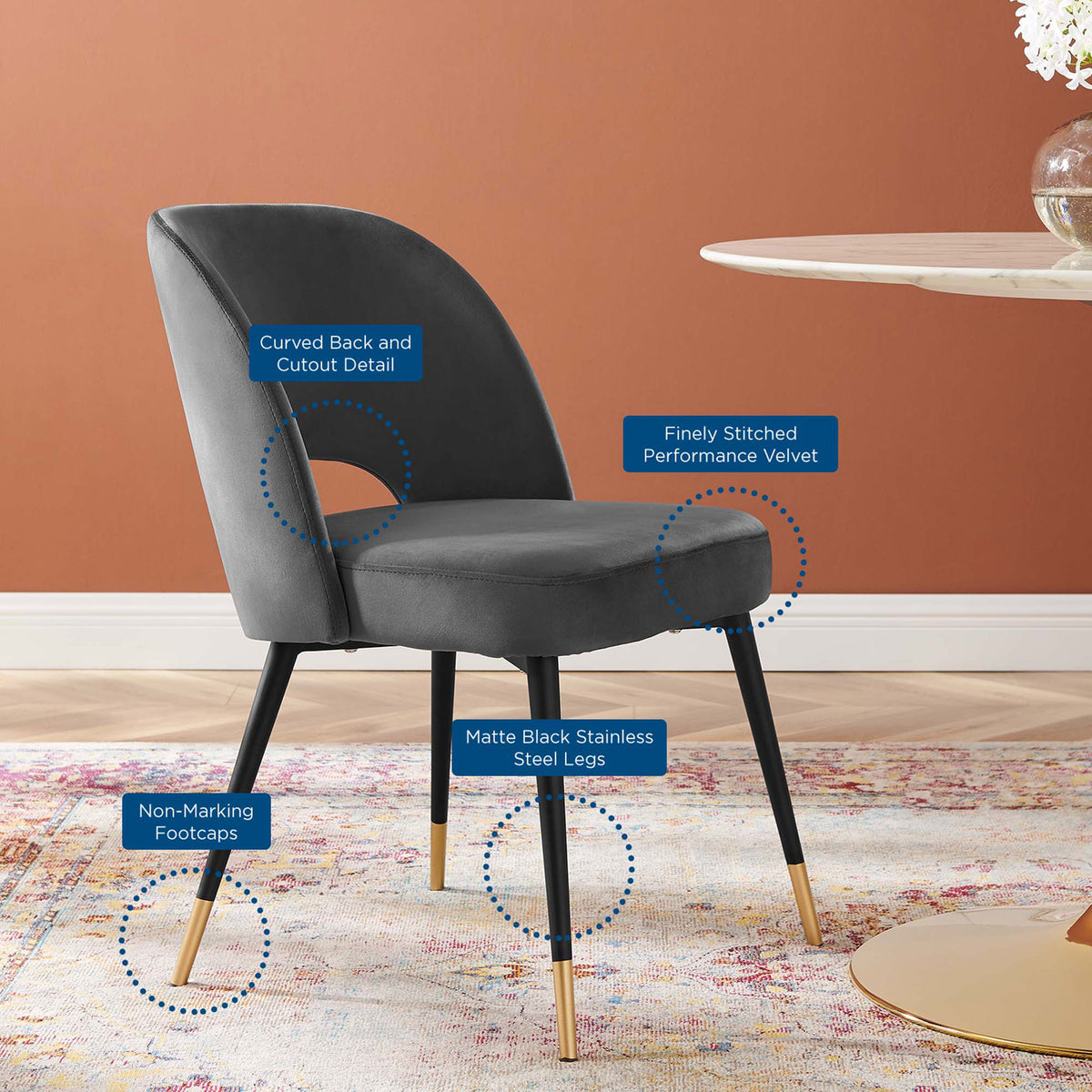 Charcoal velvet dining chair showcasing curved back, cutout detail, and matte black metal legs. || EEI-4212-CHA || callout_room