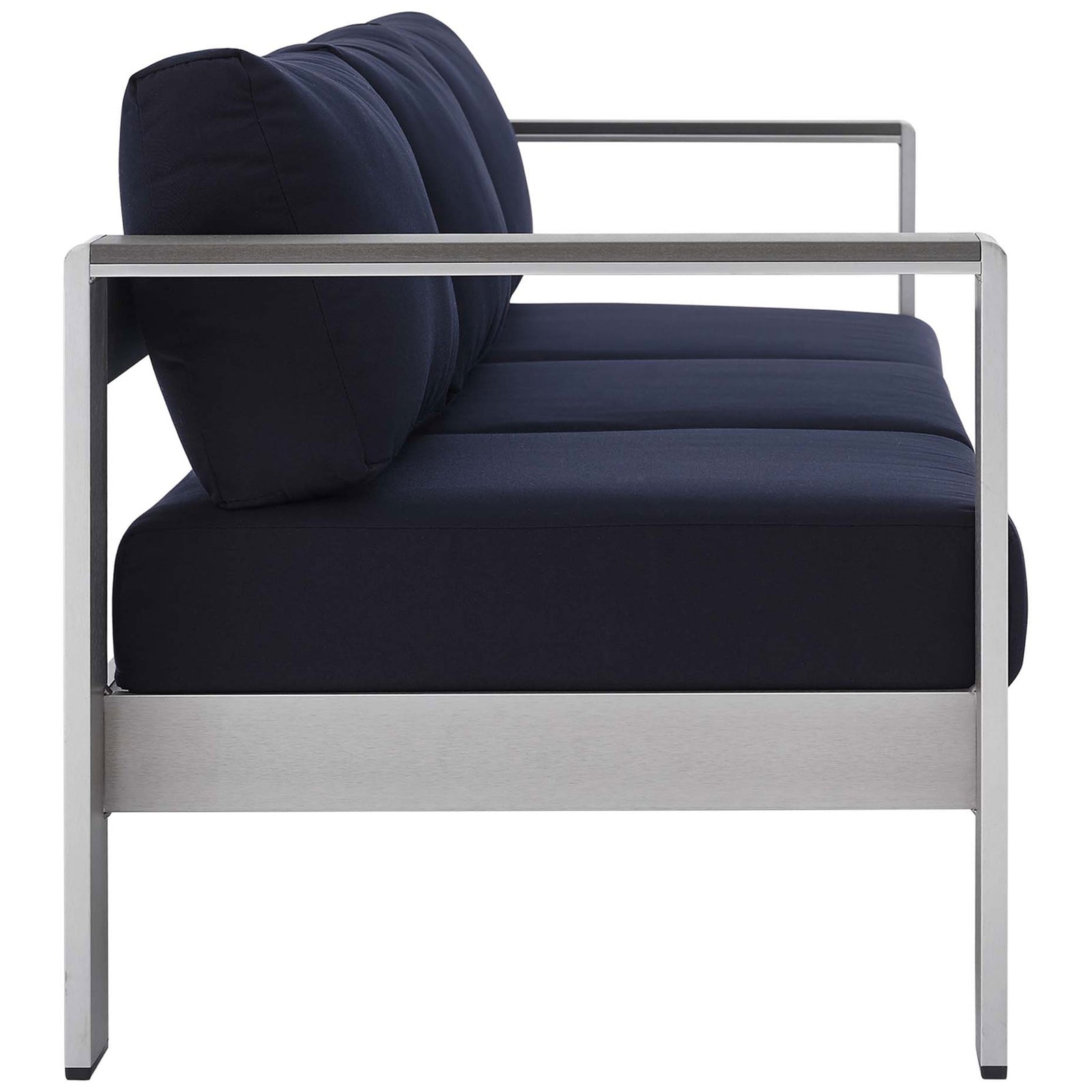 Slim silhouette showcases thick navy cushions resting on a durable brushed aluminum base || EEI-4228-SLV-NAV || side_studio