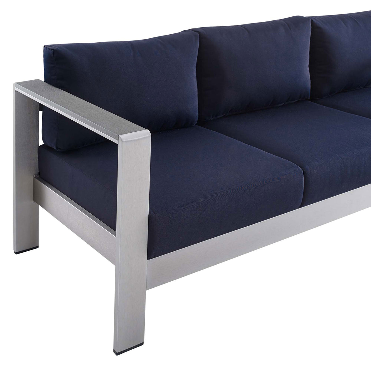 Wide metallic armrest and boxy navy cushions create a crisp, contemporary patio look || EEI-4228-SLV-NAV || detail_studio