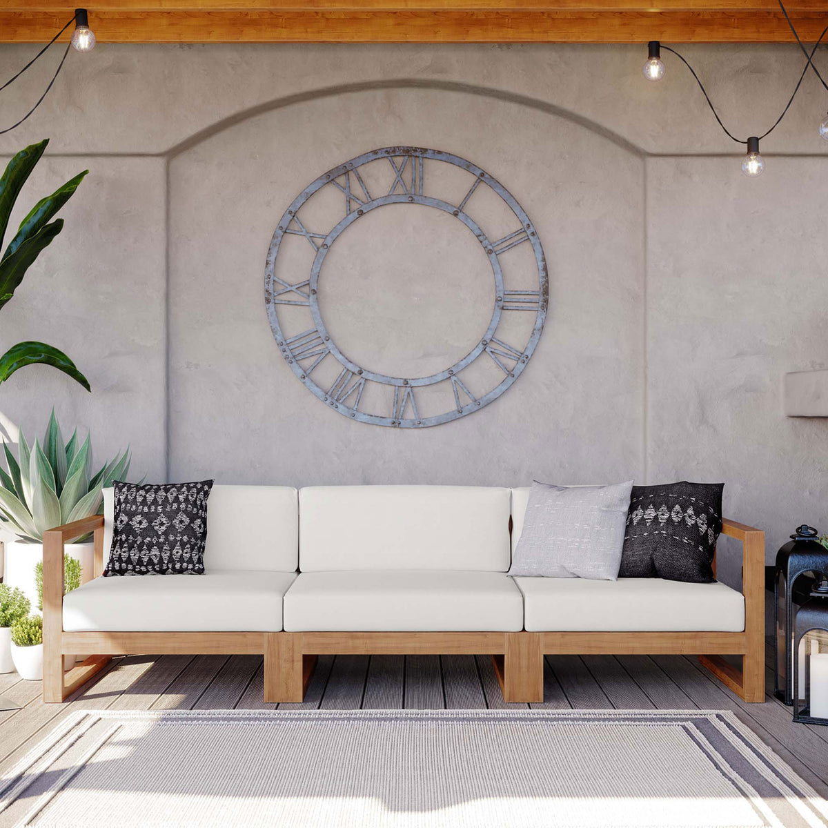 Three piece teak outdoor sectional styled with accent pillows on a covered patio || EEI-4254-NAT-WHI-SET || front_room