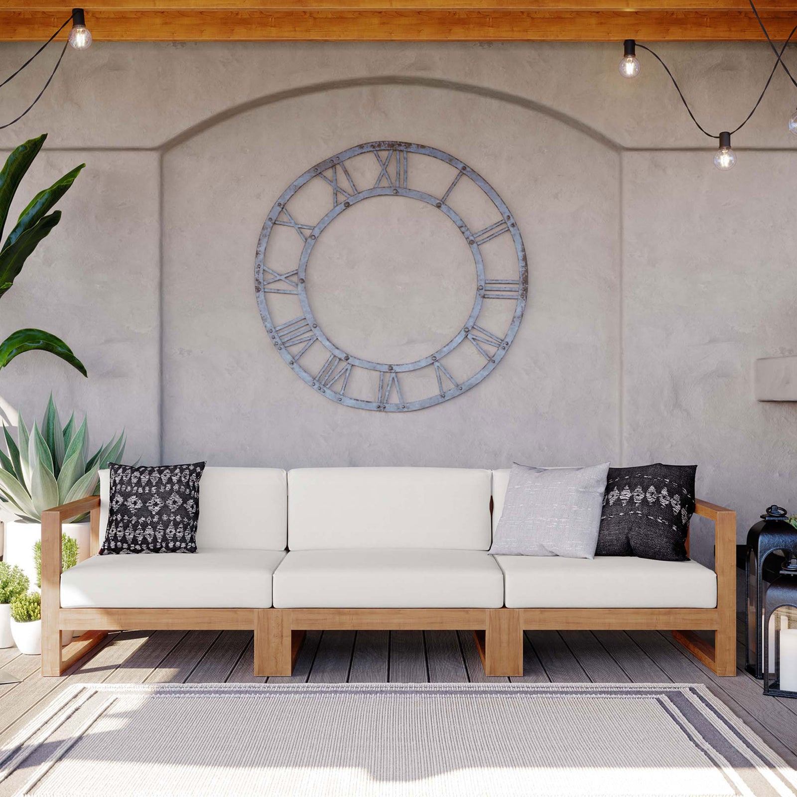 Three piece teak outdoor sectional styled with accent pillows on a covered patio || EEI-4254-NAT-WHI-SET || front_room