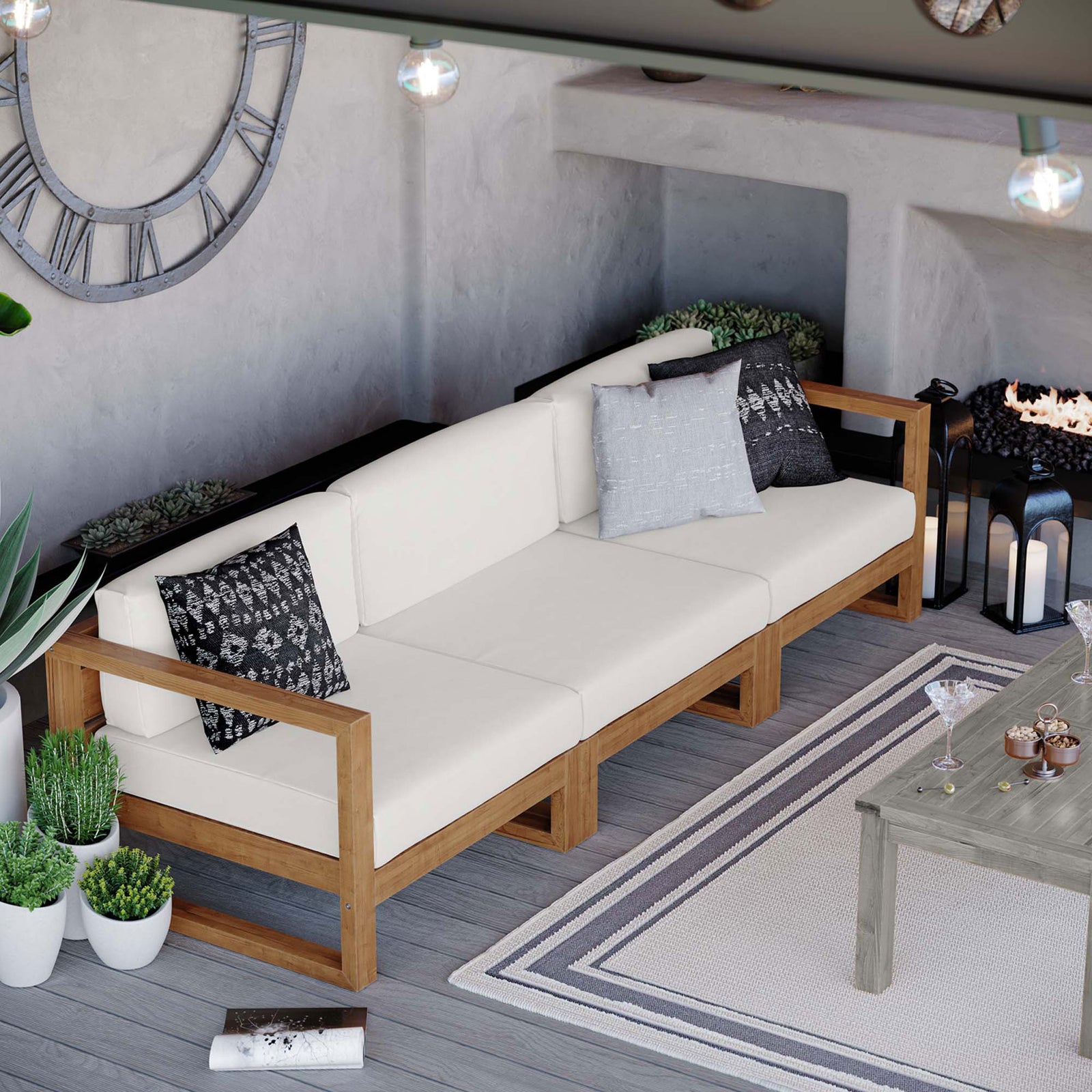 Teak sectional sofa creating a cozy outdoor living area beside a modern fire feature || EEI-4254-NAT-WHI-SET || front_angle_room