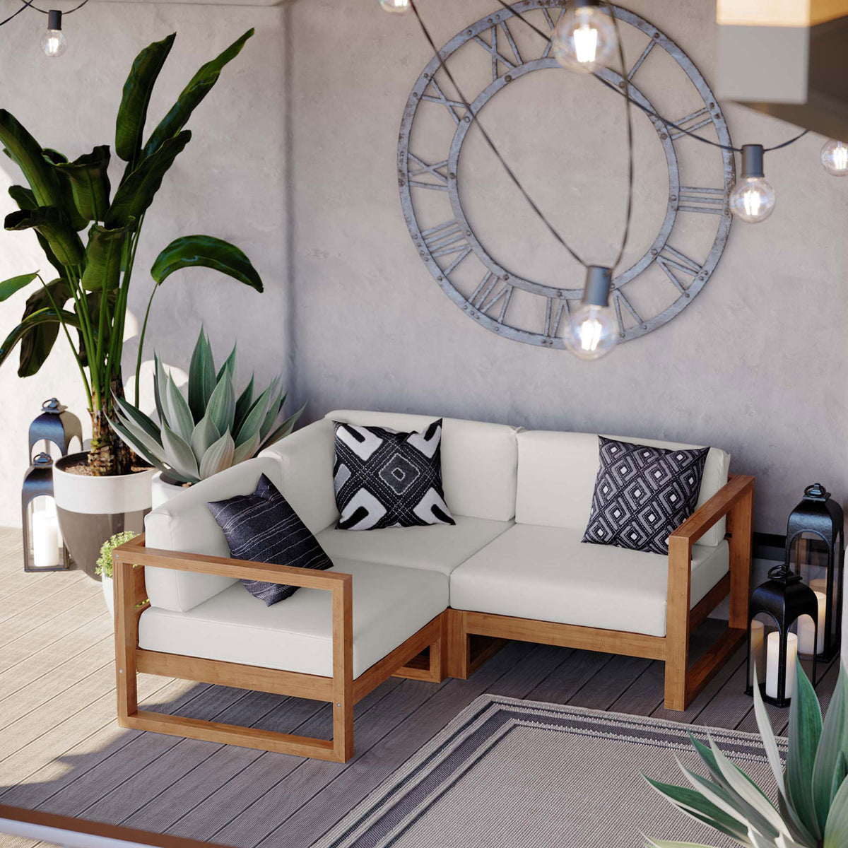 Cozy outdoor corner with teak sectional, lush plants, lanterns, and string lights for relaxed evenings || EEI-4255-NAT-WHI-SET || front_angle_room