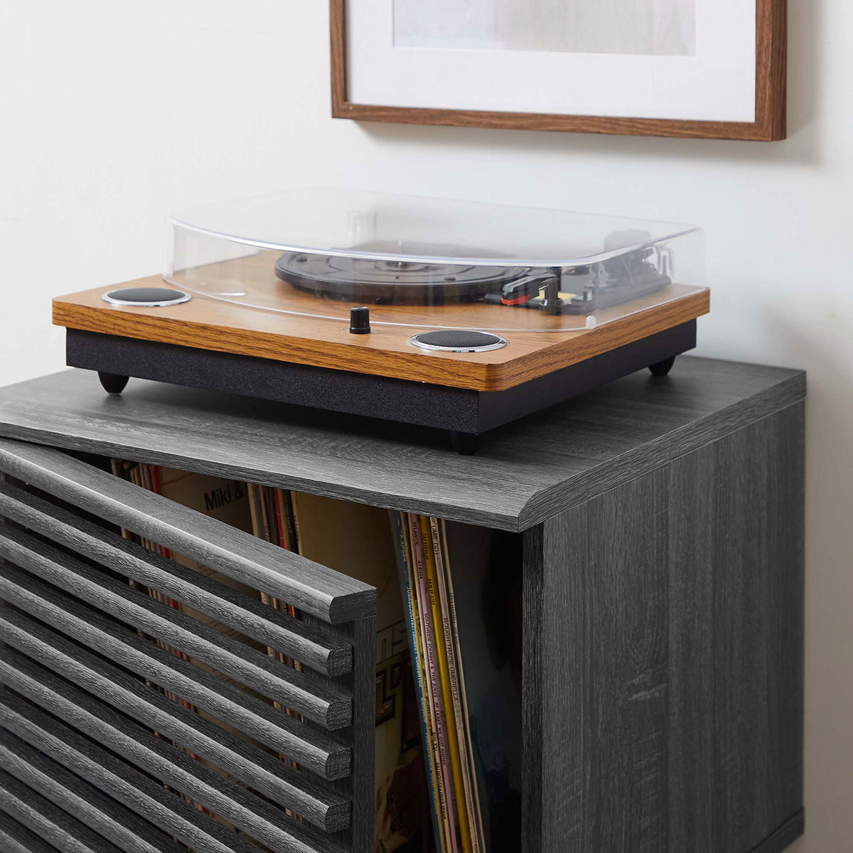 Record stand keeps albums and turntable within reach, blending charcoal wood tones into a modern room setting. || EEI-4262-CHA || detail_open_room