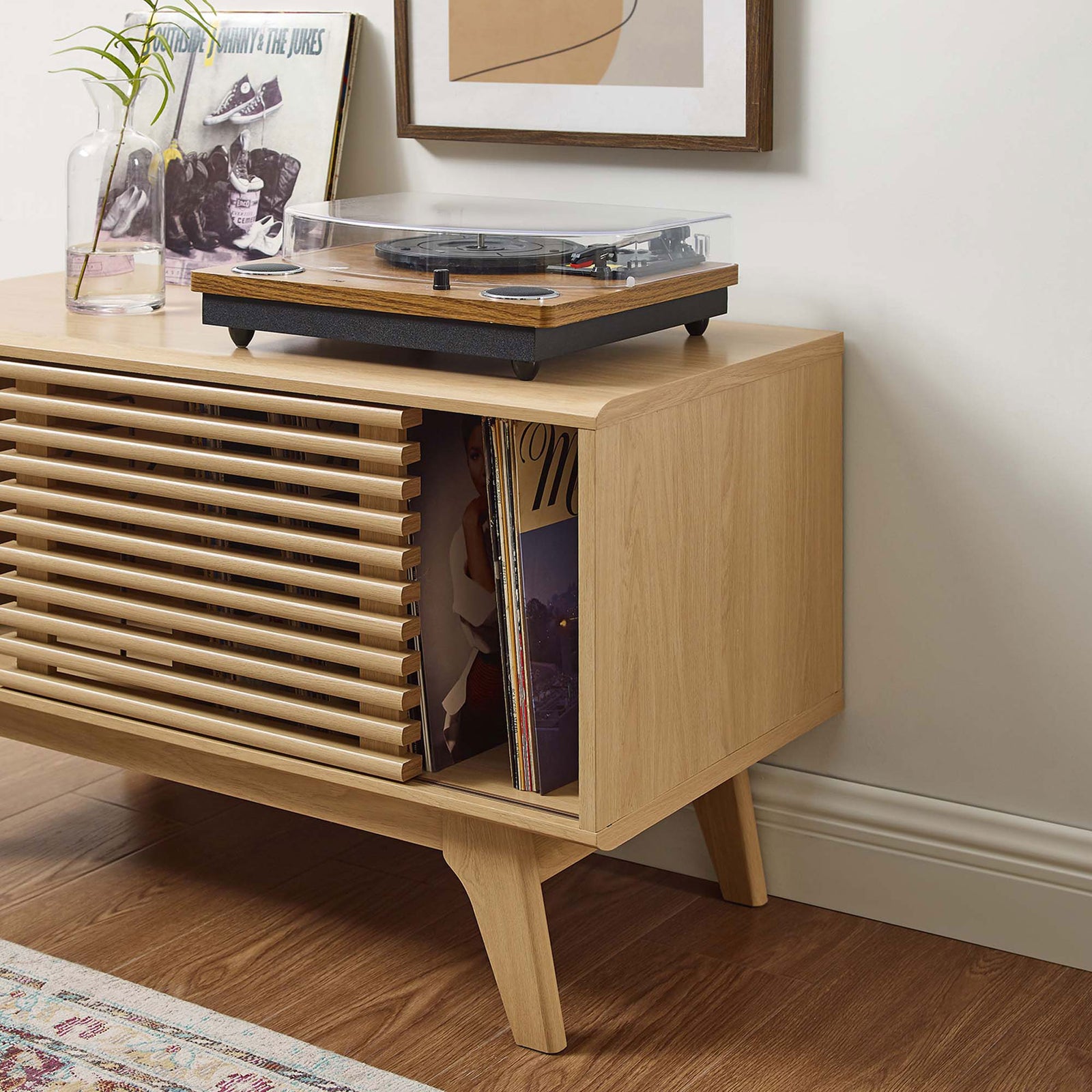 Oak record stand showing easy access to albums with open storage and turntable above for listening. || EEI-4263-OAK || storage_open_room
