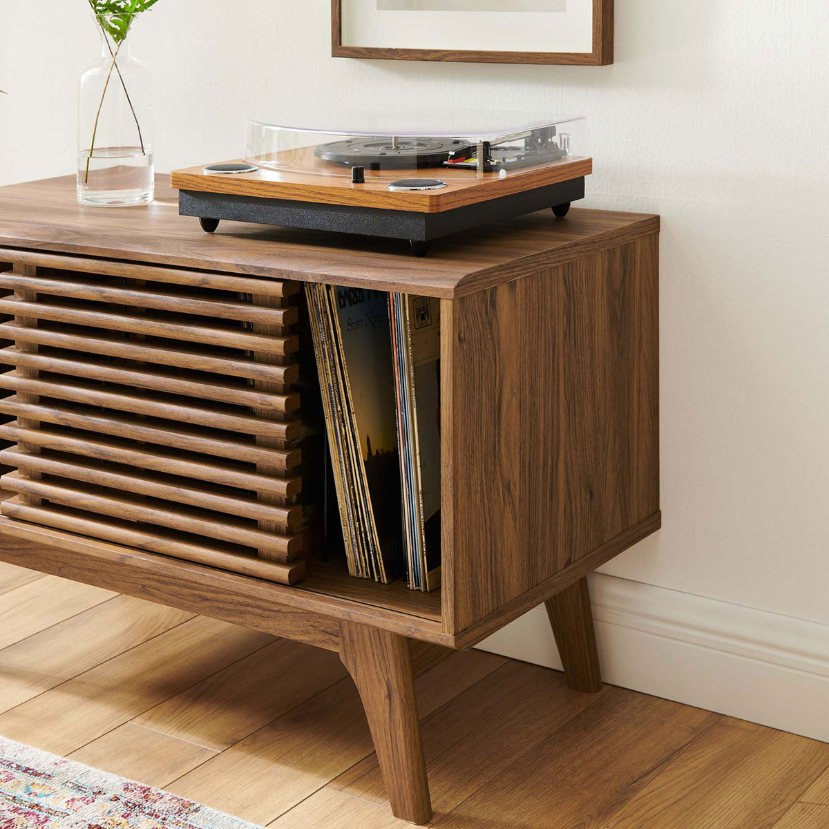 Walnut record stand showing easy access to albums with open storage and turntable above. || EEI-4263-WAL || storage_open_room