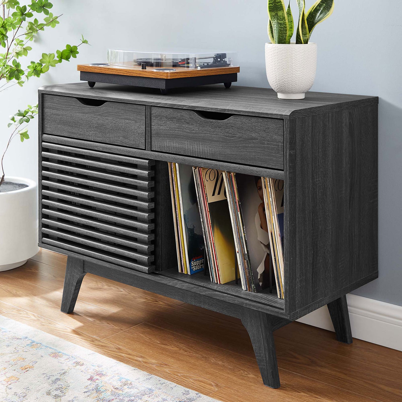 Charcoal record stand styled in a modern living room with a turntable and neatly organized vinyl collection || EEI-4323-CHA || front_angle_room