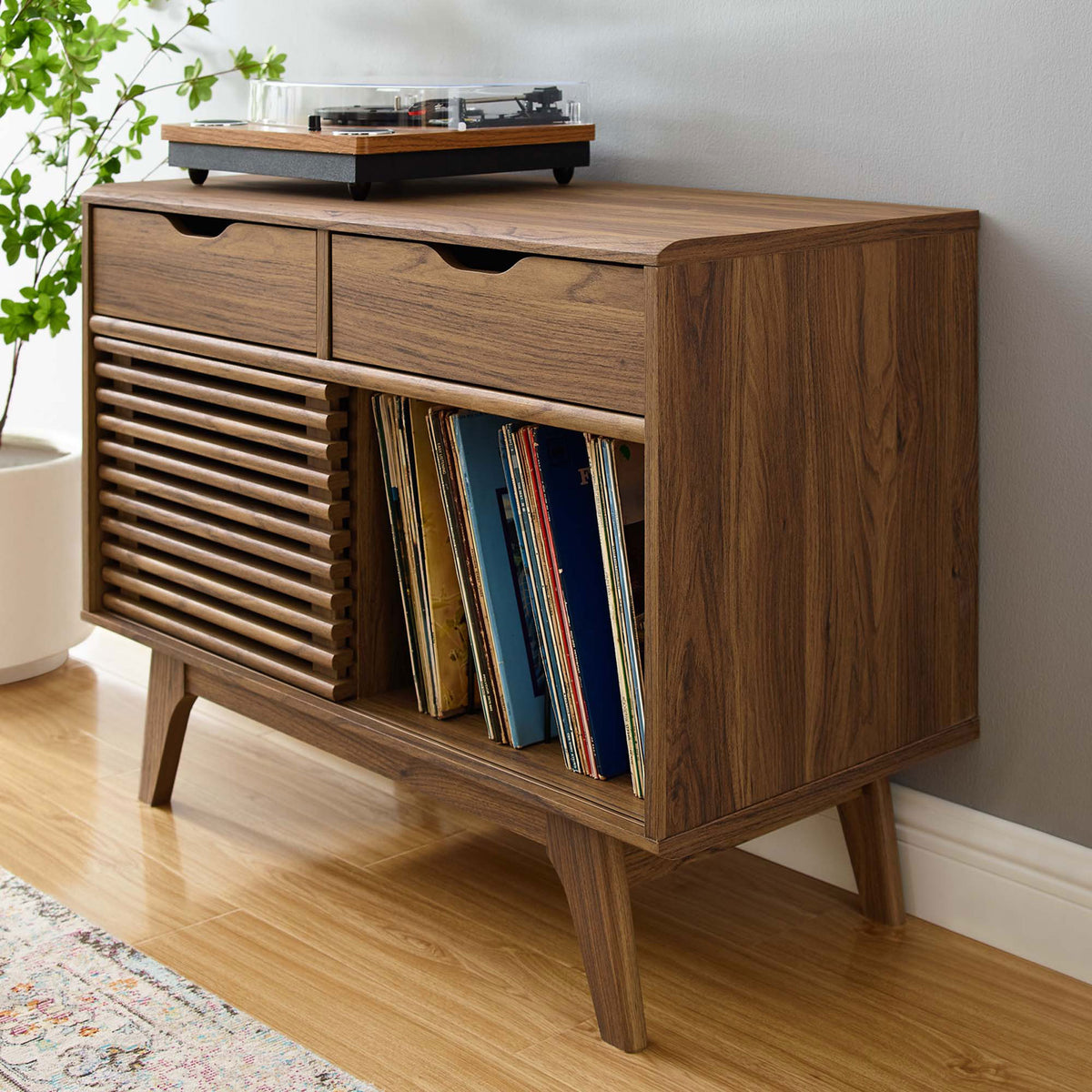 Walnut record stand styled with a turntable and decor, highlighting warm wood tones and organized vinyl storage || EEI-4323-WAL || front_angle_room