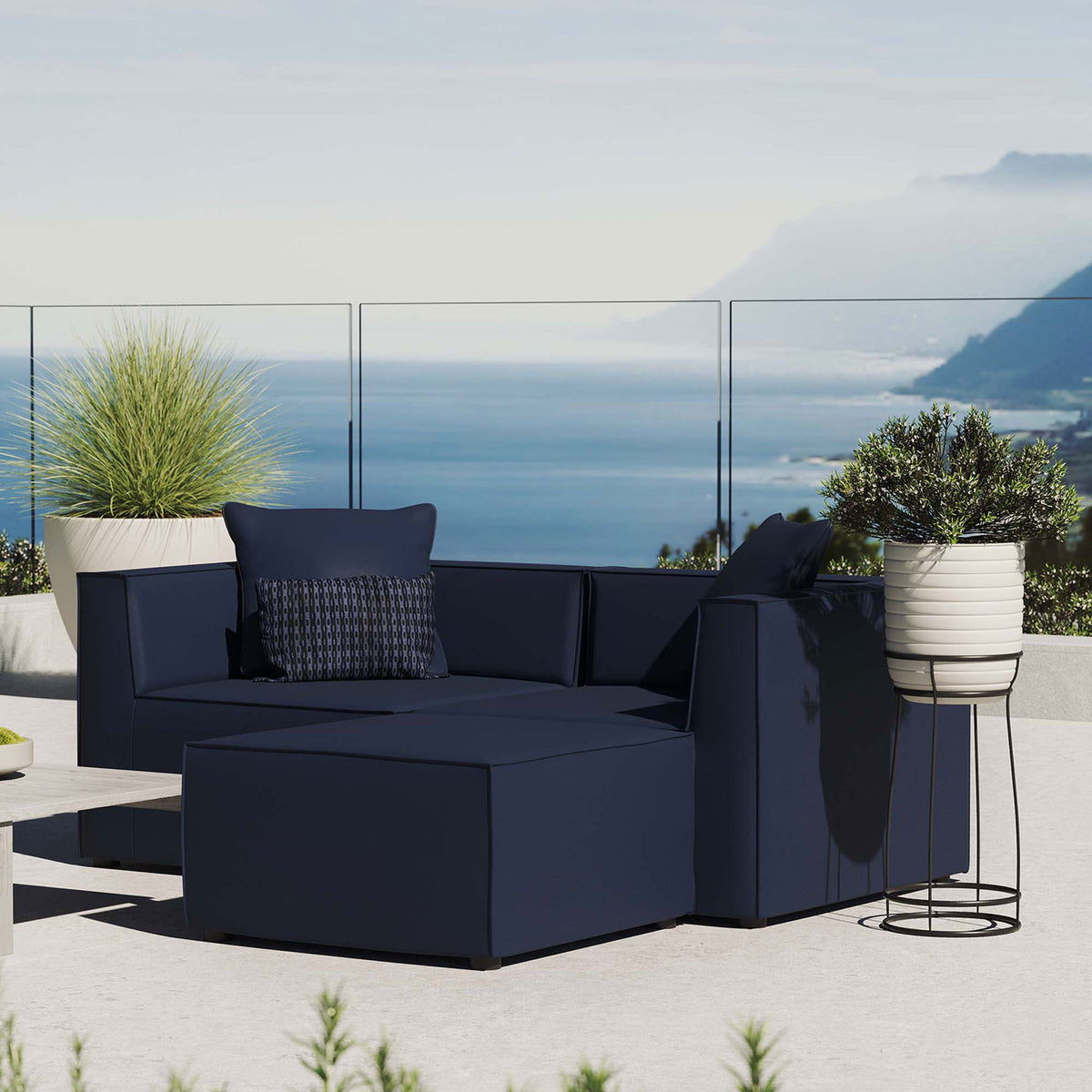 Navy outdoor loveseat and ottoman arranged on a terrace for chic coastal-style relaxation || EEI-4378-NAV || front_angle_room