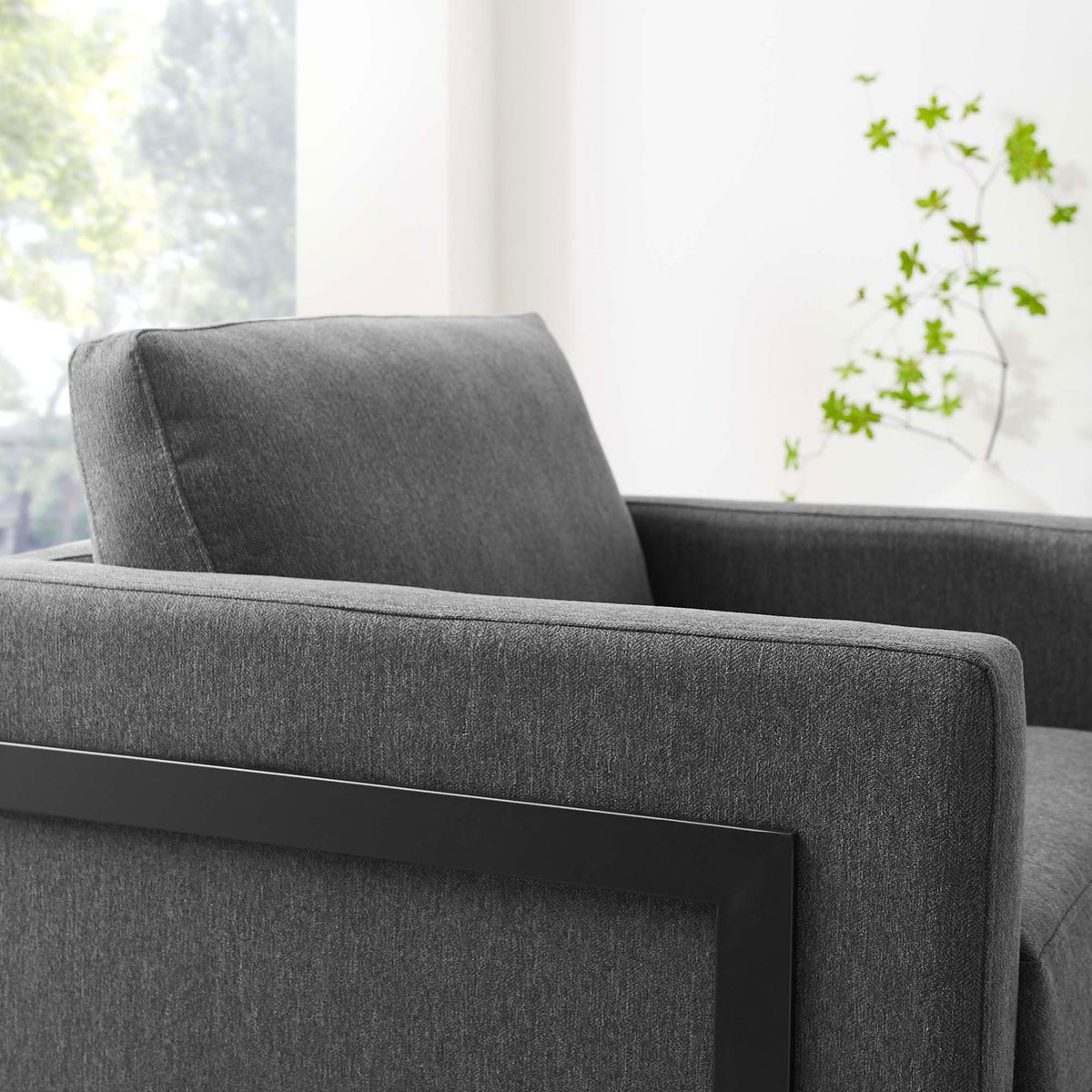 Plush back cushion and tailored upholstery invite relaxing comfort in a bright, airy setting || EEI-4391-BLK-CHA || detail_room