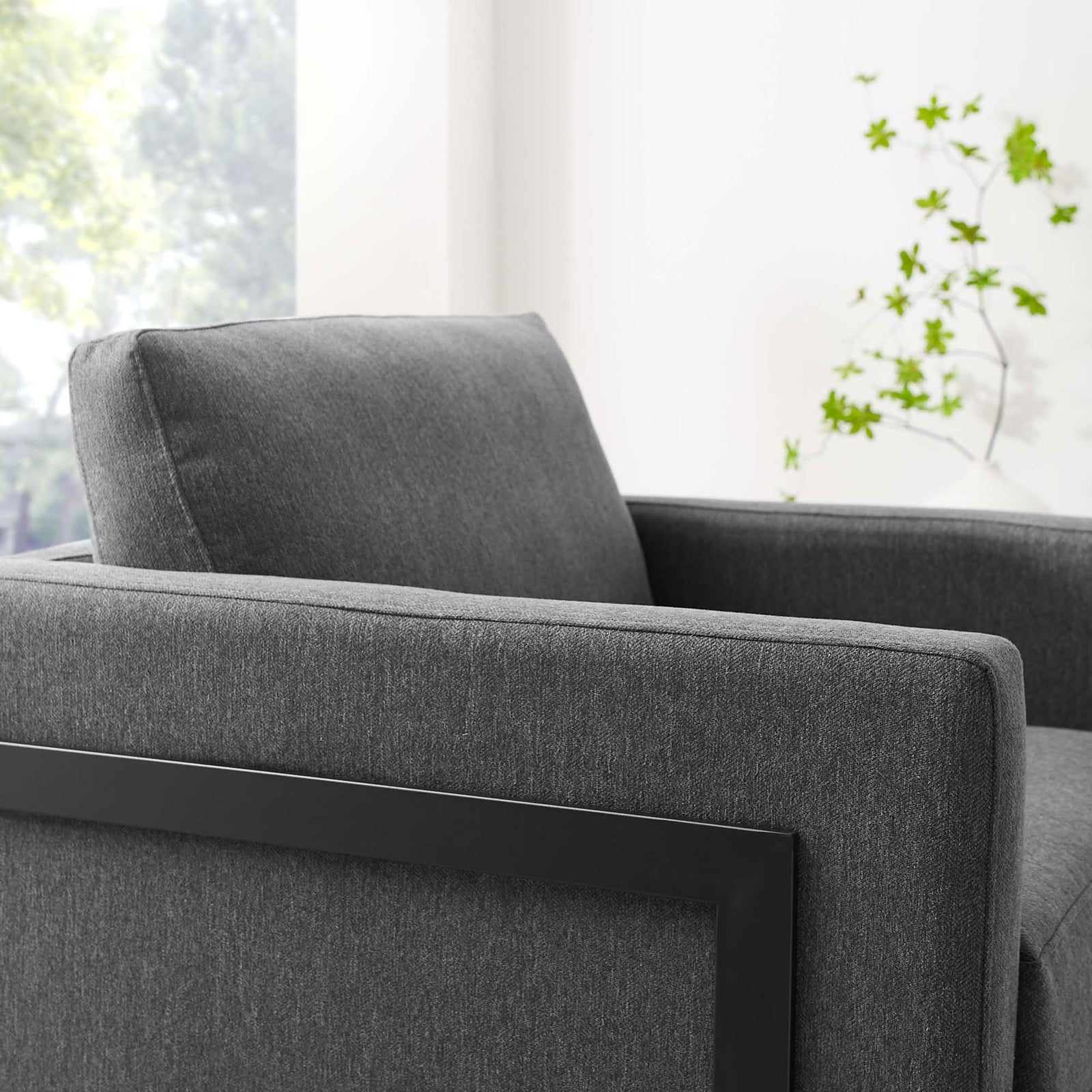 Plush back cushion and tailored upholstery invite relaxing comfort in a bright, airy setting || EEI-4391-BLK-CHA || detail_room