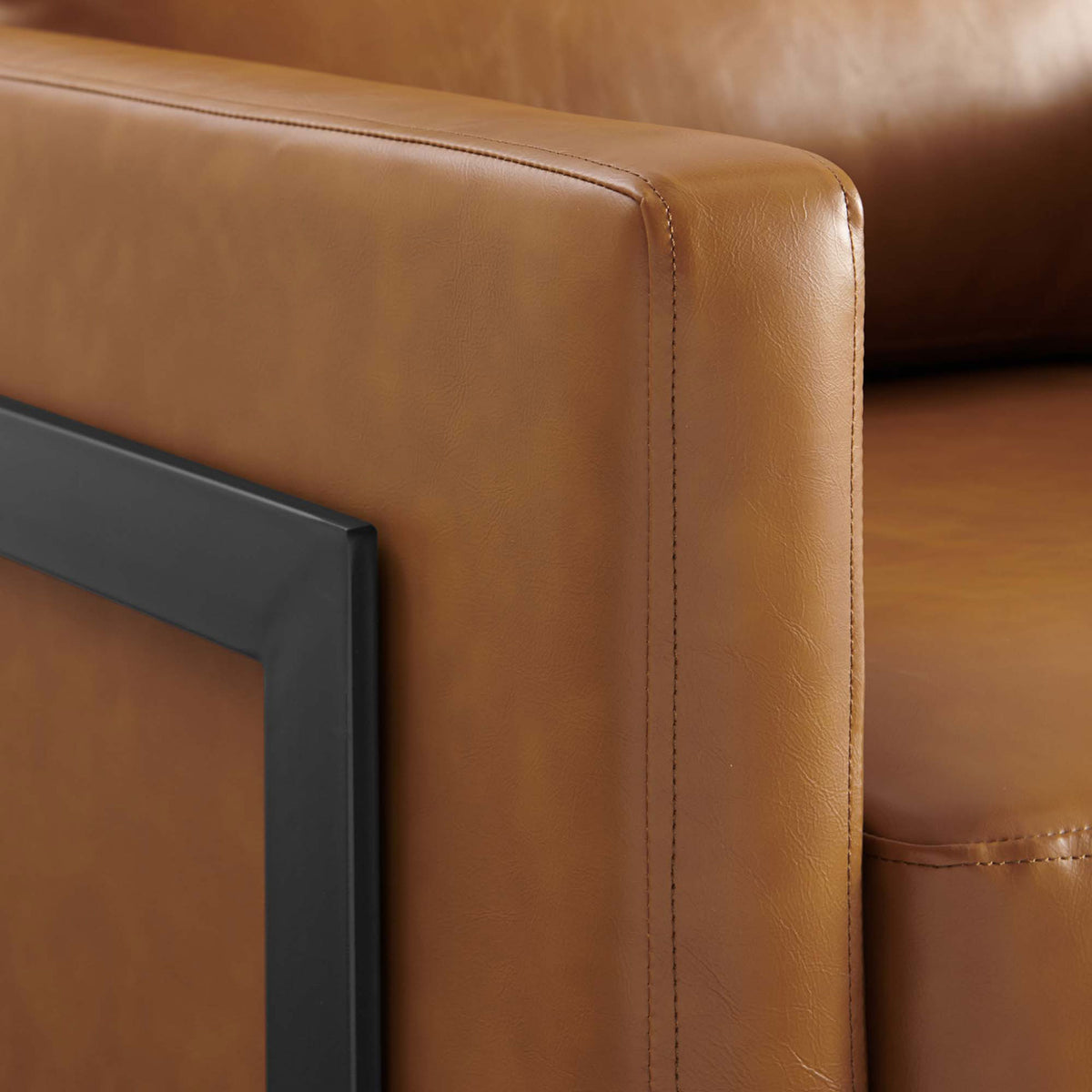 Close-fit stitching and smooth edges pair with a matte black stainless steel frame for refined contrast || EEI-4392-BLK-TAN || detail_studio
