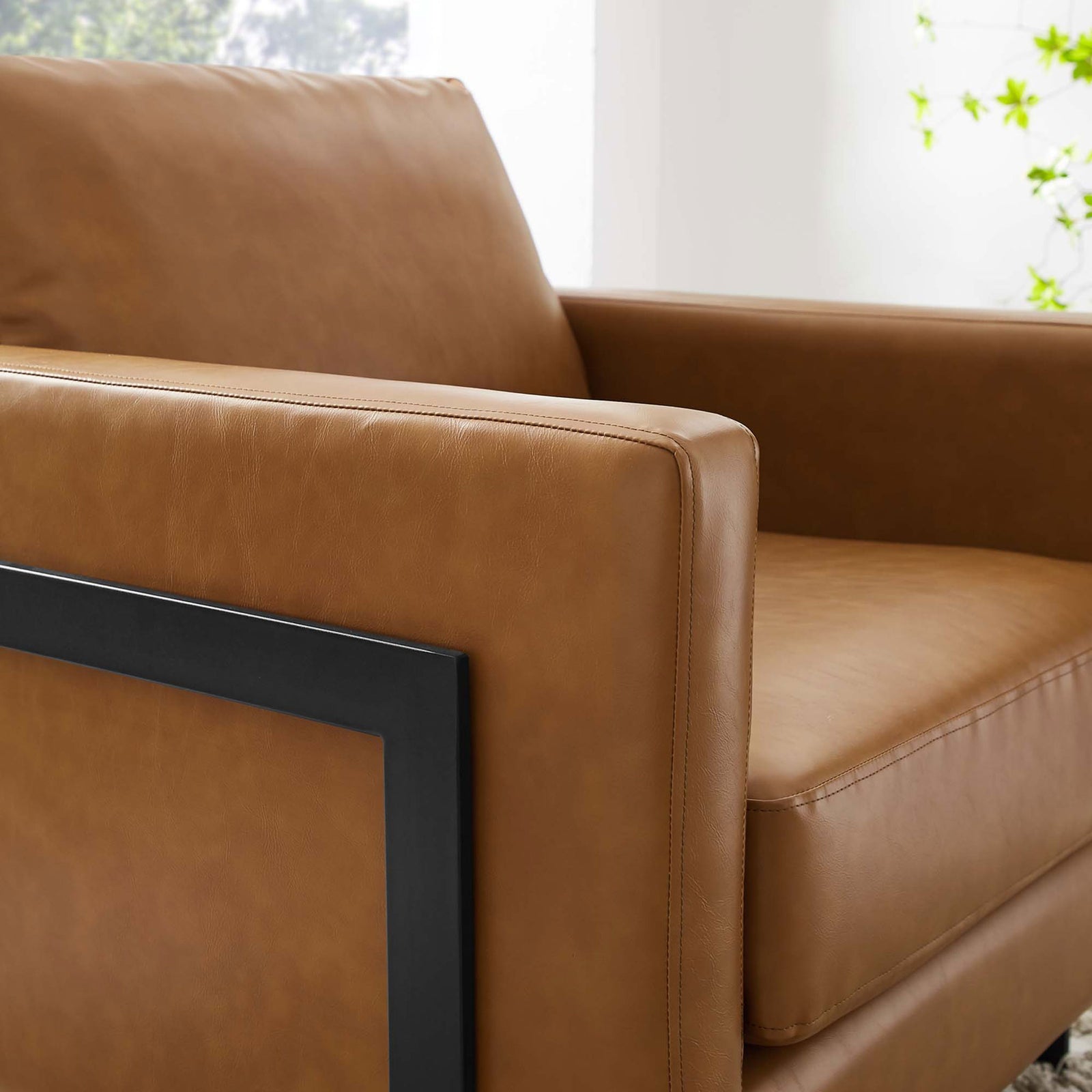 Warm tan vegan leather and generous padding bring lounge-worthy comfort to modern spaces || EEI-4392-BLK-TAN || detail_room