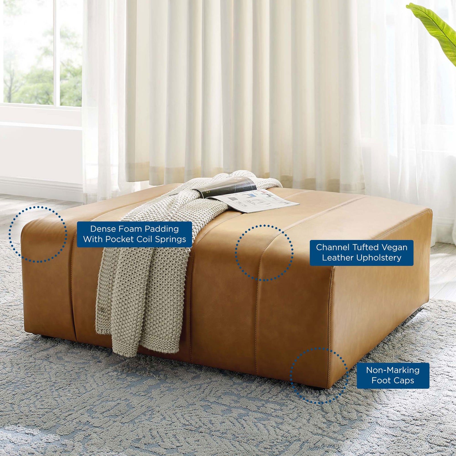 Room view of the Bartlett ottoman with callouts to dense foam, pocket coil support, and non-marking foot caps || EEI-4401-TAN || callout_room