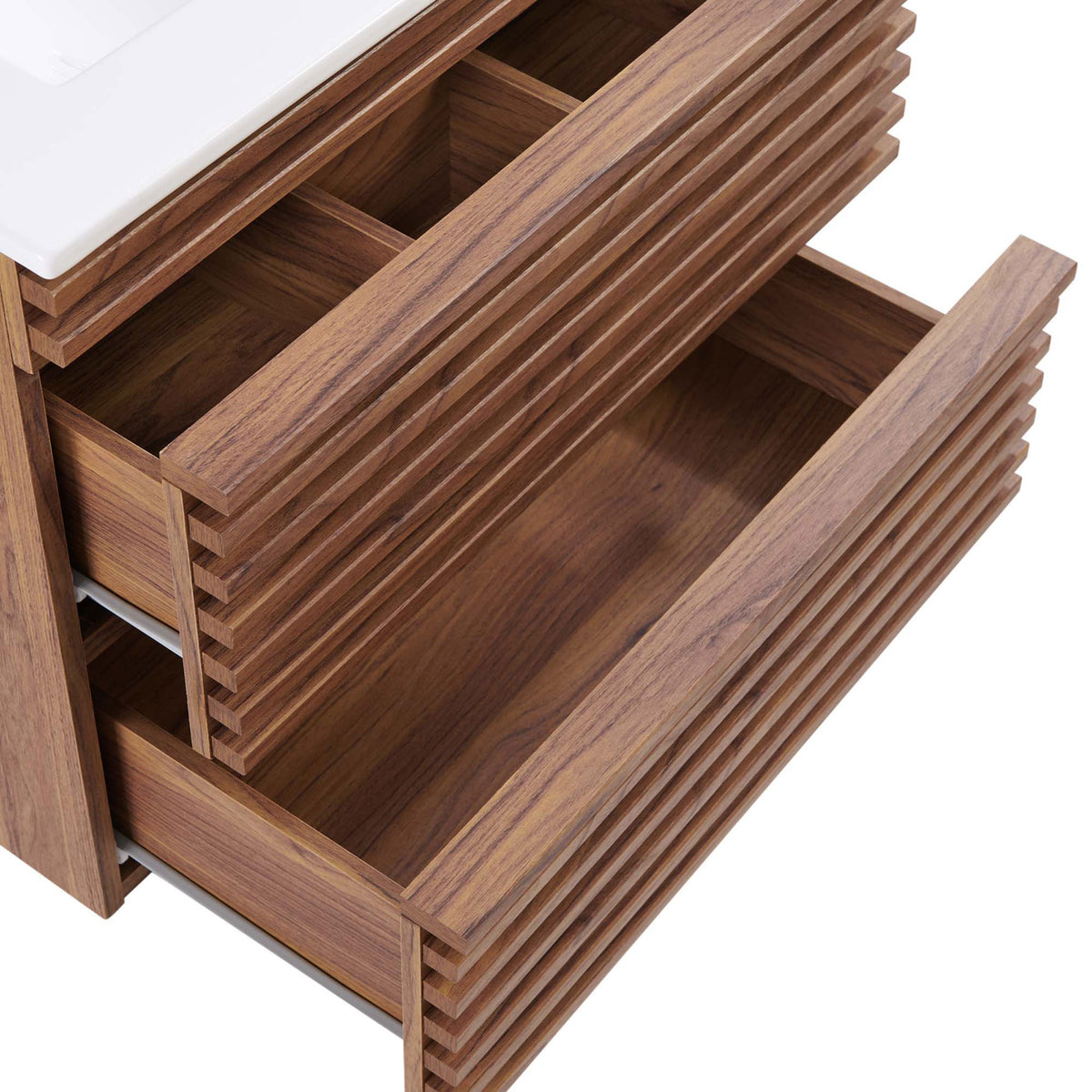 Organized storage with divided top drawer and deep lower drawer keeps bath essentials tidy in the 24-inch vanity. || EEI-4433-WAL-WHI || storage_open_studio