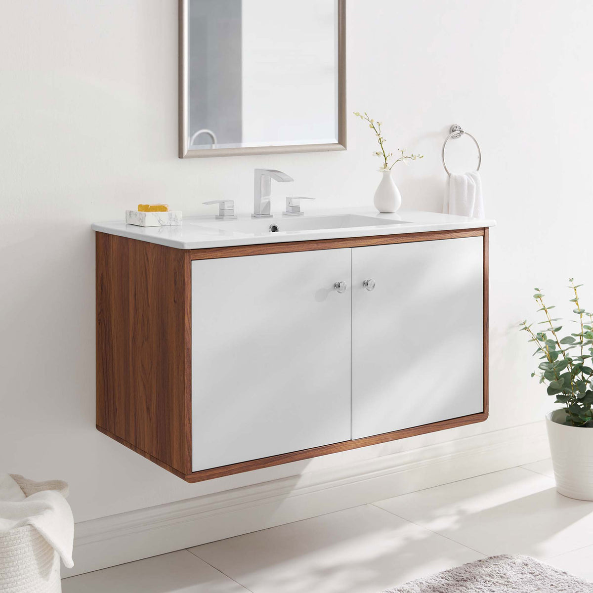 Wall-mounted vanity anchors the space with modern lines and inviting wood tones. || EEI-4434-WAL-WHI || front_angle_room