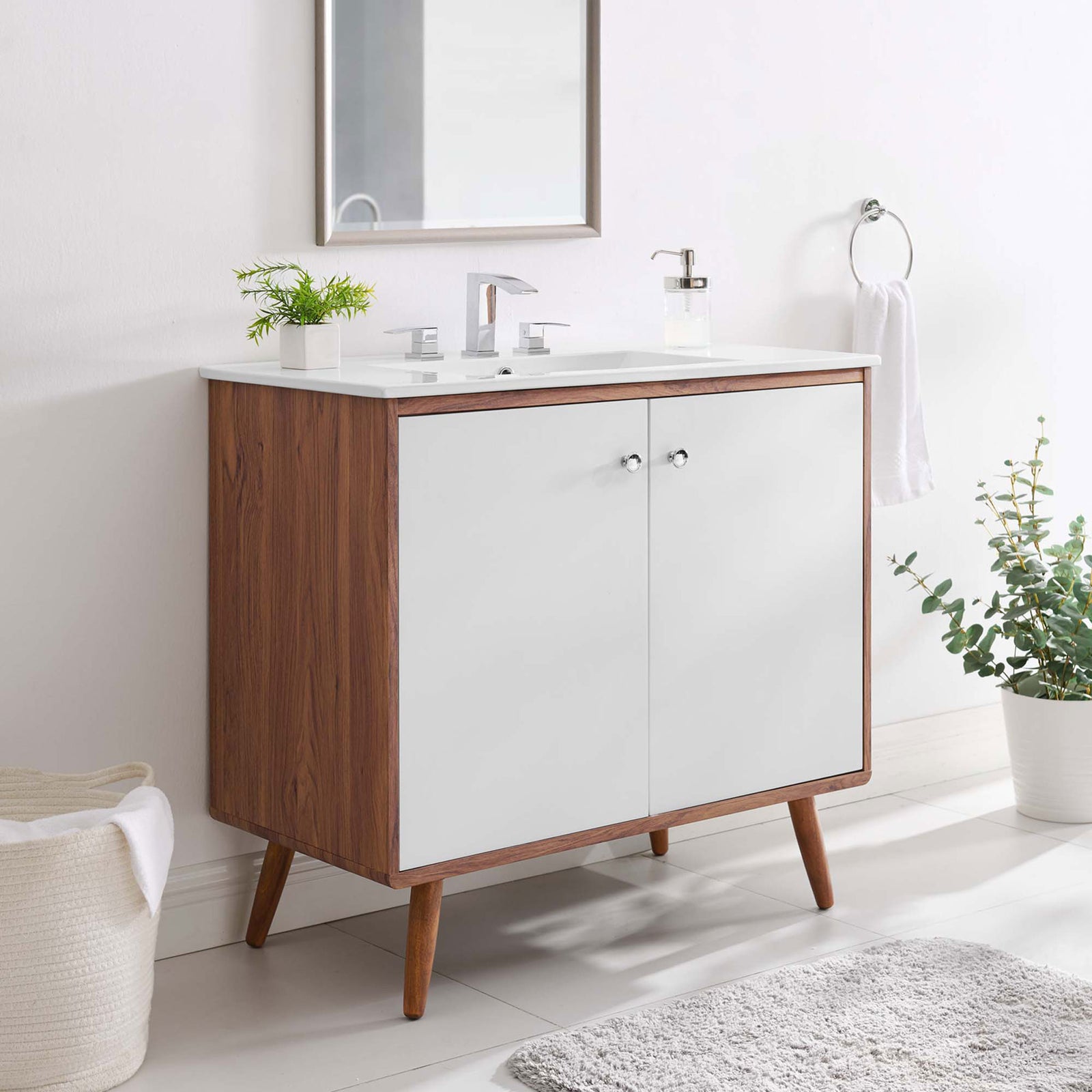 Styled in a bright bath, the 36-inch vanity adds warm walnut texture to clean white spaces. || EEI-4435-WAL-WHI || front_angle_room
