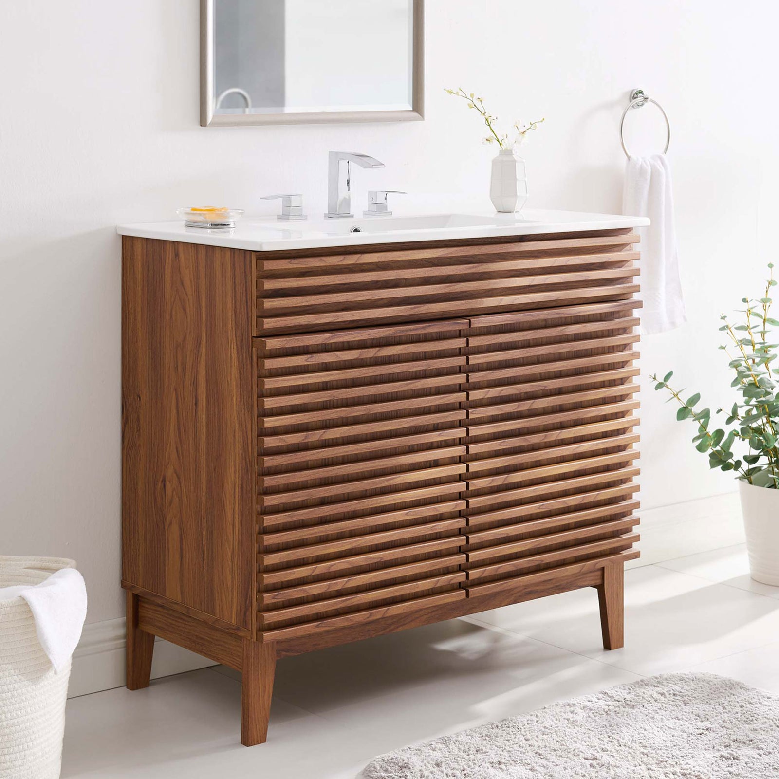 Walnut slat design and a crisp white top bring modern warmth to the bathroom. || EEI-4437-WAL-WHI || front_angle_room
