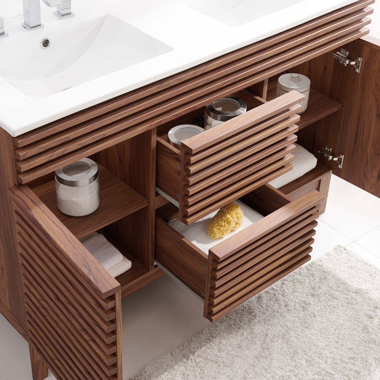 Generous storage behind doors and drawers keeps bath essentials organized || EEI-4441-WAL-WHI || front_angle_open_room