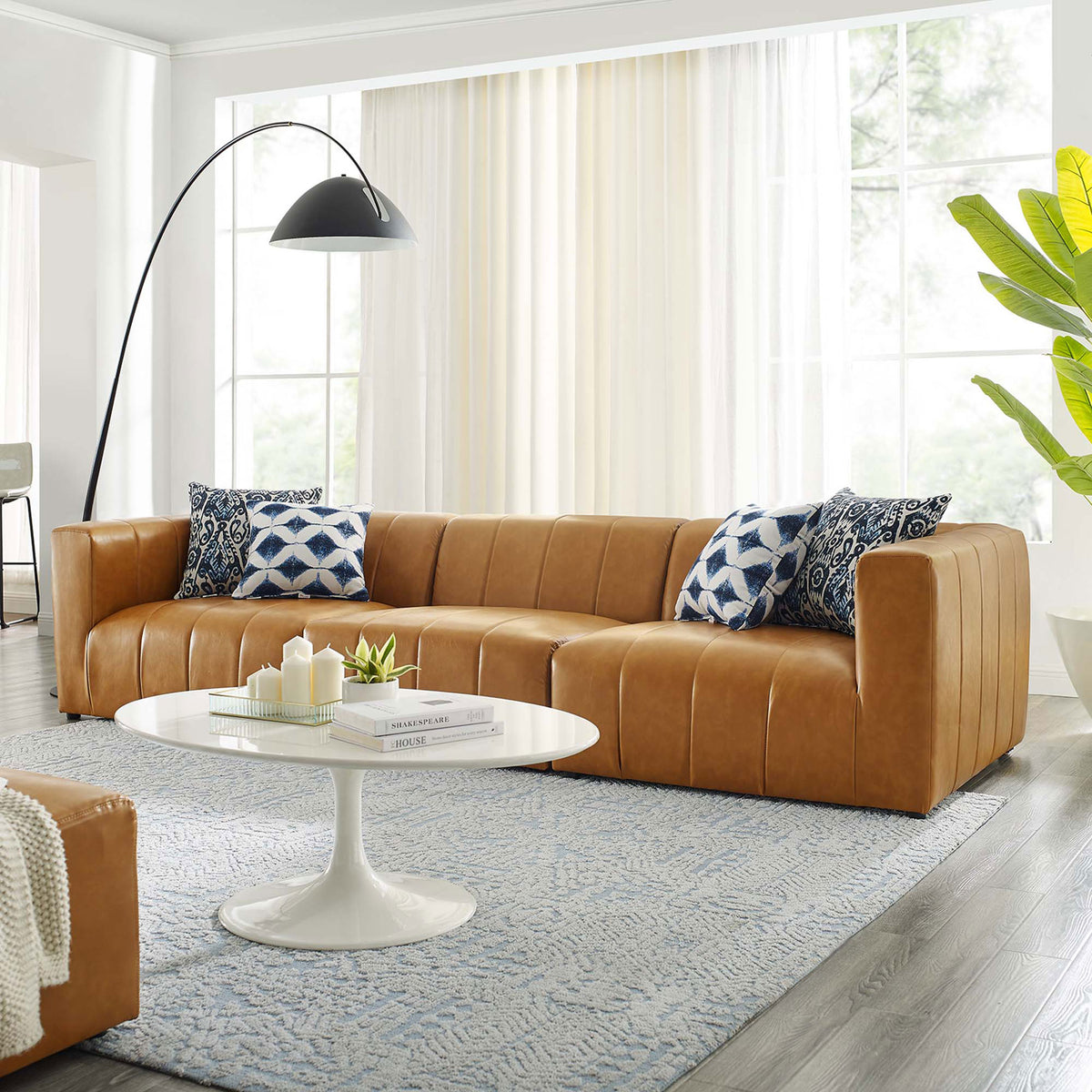 Bartlett tan vegan leather 3-piece sofa styled in a bright living room with modern decor || EEI-4515-TAN || front_angle_room