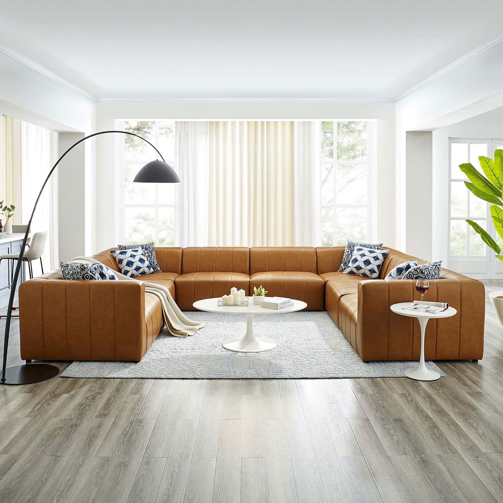 Tan Bartlett 8-piece vegan leather sectional sofa styled in a modern open living room || EEI-4536-TAN || front_angle_room