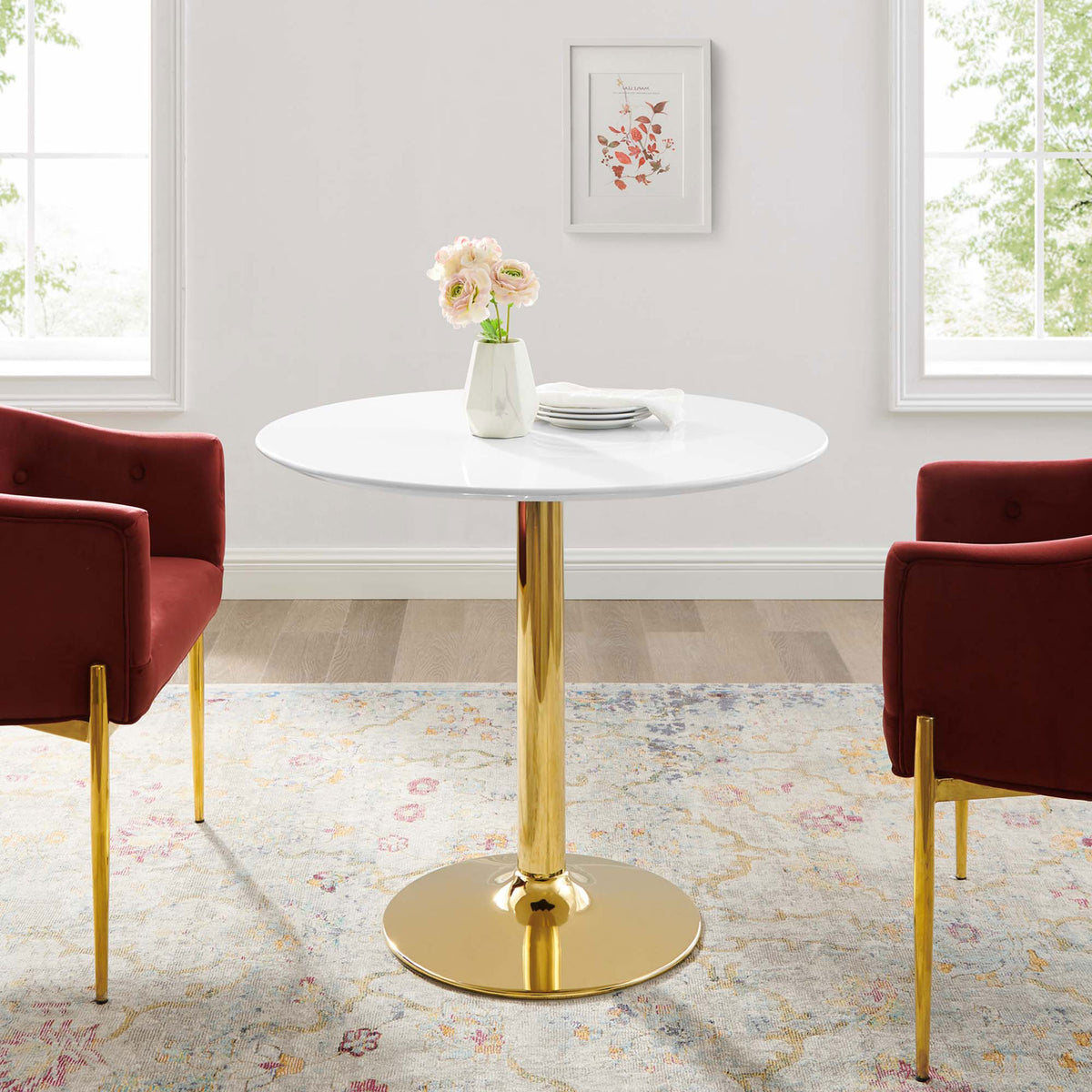 Verne 35-inch round dining table paired with red chairs in a cozy contemporary dining room || EEI-4544-GLD-WHI || front_room