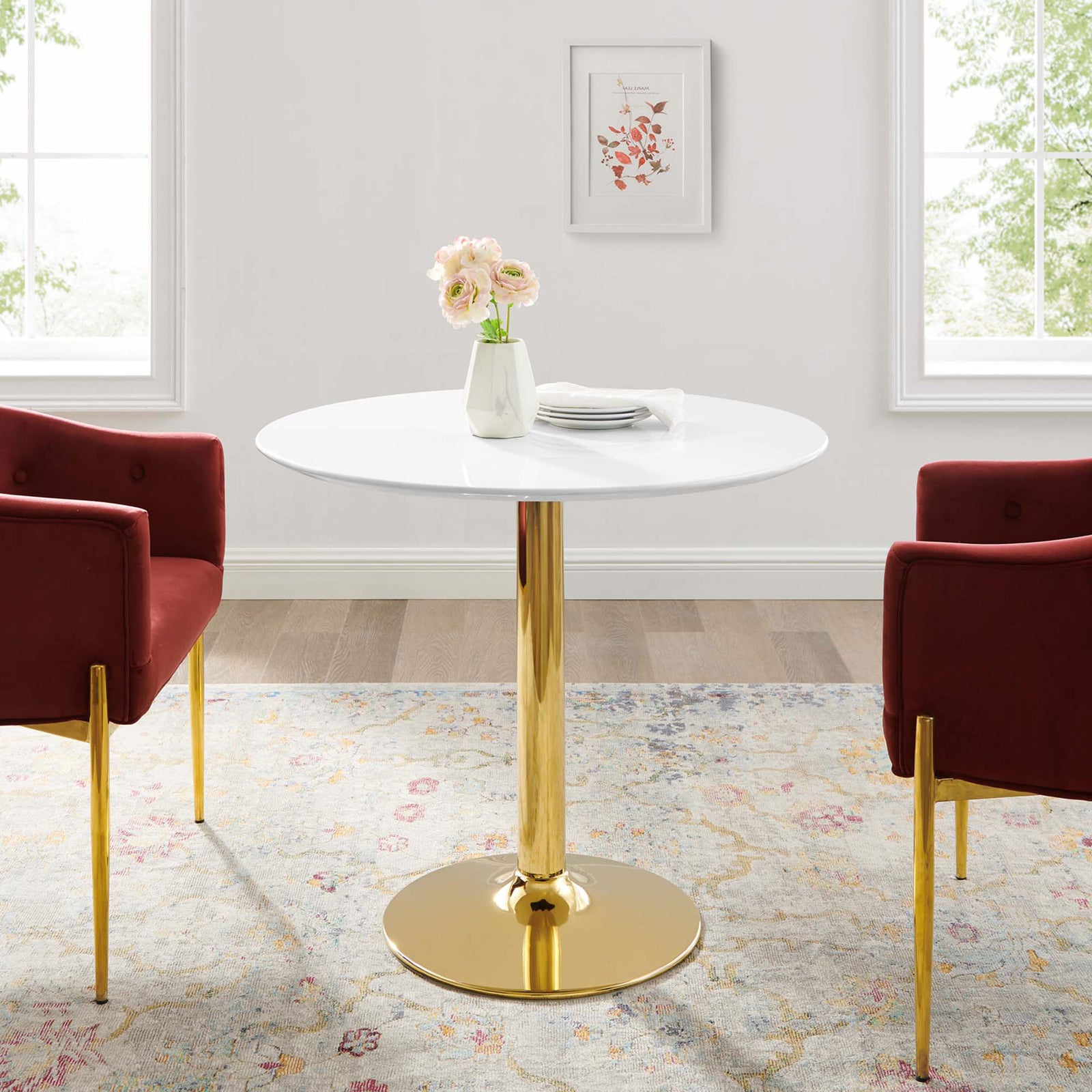 Verne 35-inch round dining table paired with red chairs in a cozy contemporary dining room || EEI-4544-GLD-WHI || front_room