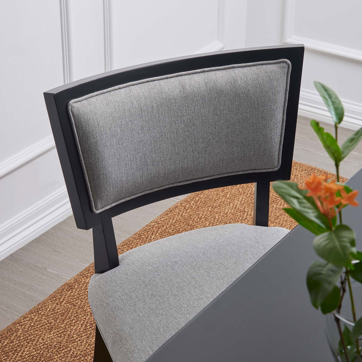 Close-up of light gray dining chair backrest highlighting soft fabric texture and contrast piping || EEI-4557-LGR || detail_room