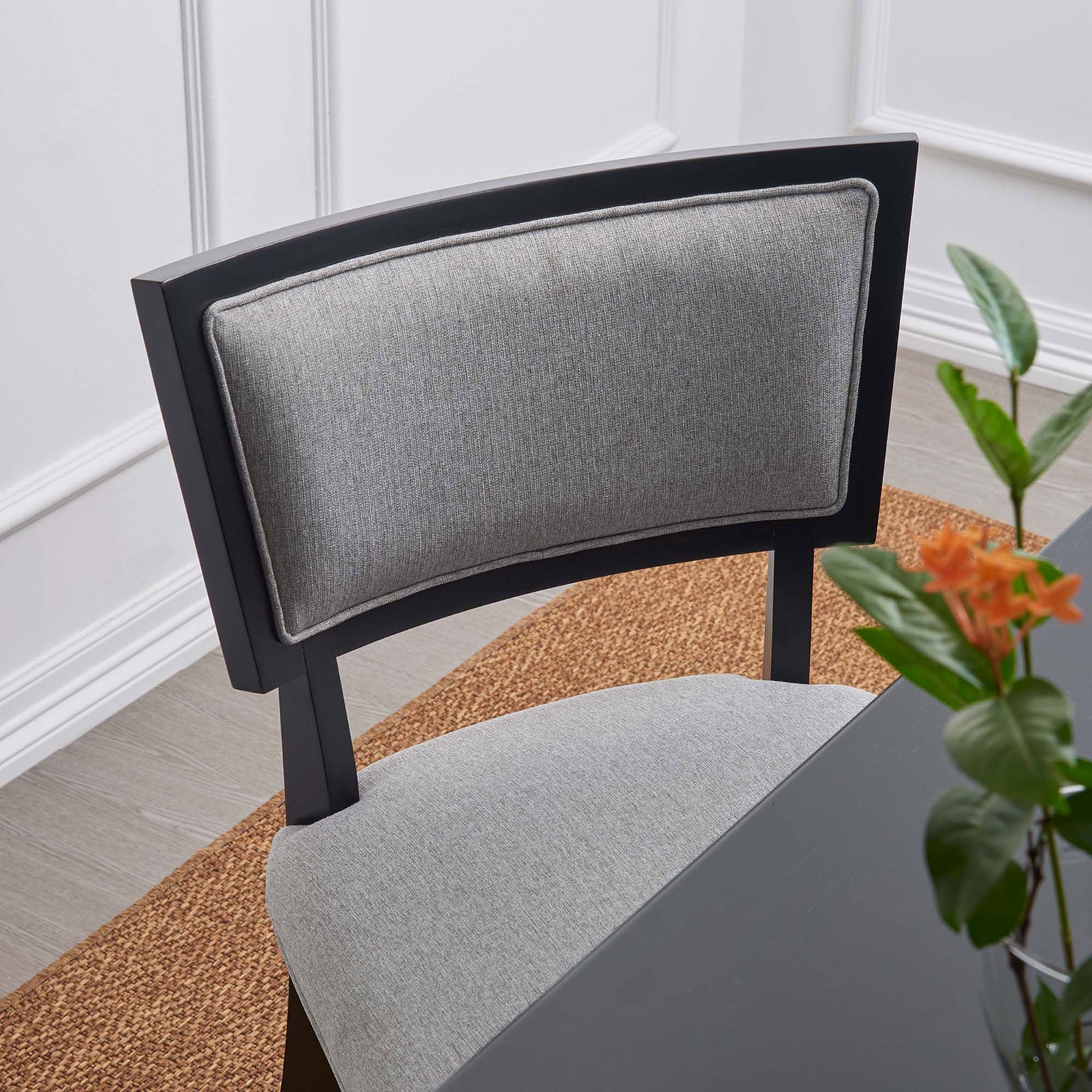 Close-up of light gray dining chair backrest highlighting soft fabric texture and contrast piping || EEI-4557-LGR || detail_room