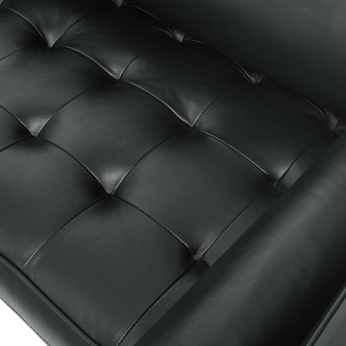 Tufted black top grain leather seat on the Valour sofa showcases plush cushioning and subtle natural texture. || EEI-4633-BLK || swatch_studio