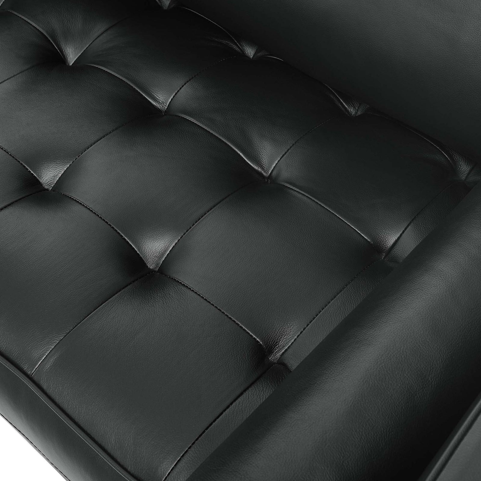 Tufted black top grain leather seat on the Valour sofa showcases plush cushioning and subtle natural texture. || EEI-4633-BLK || swatch_studio