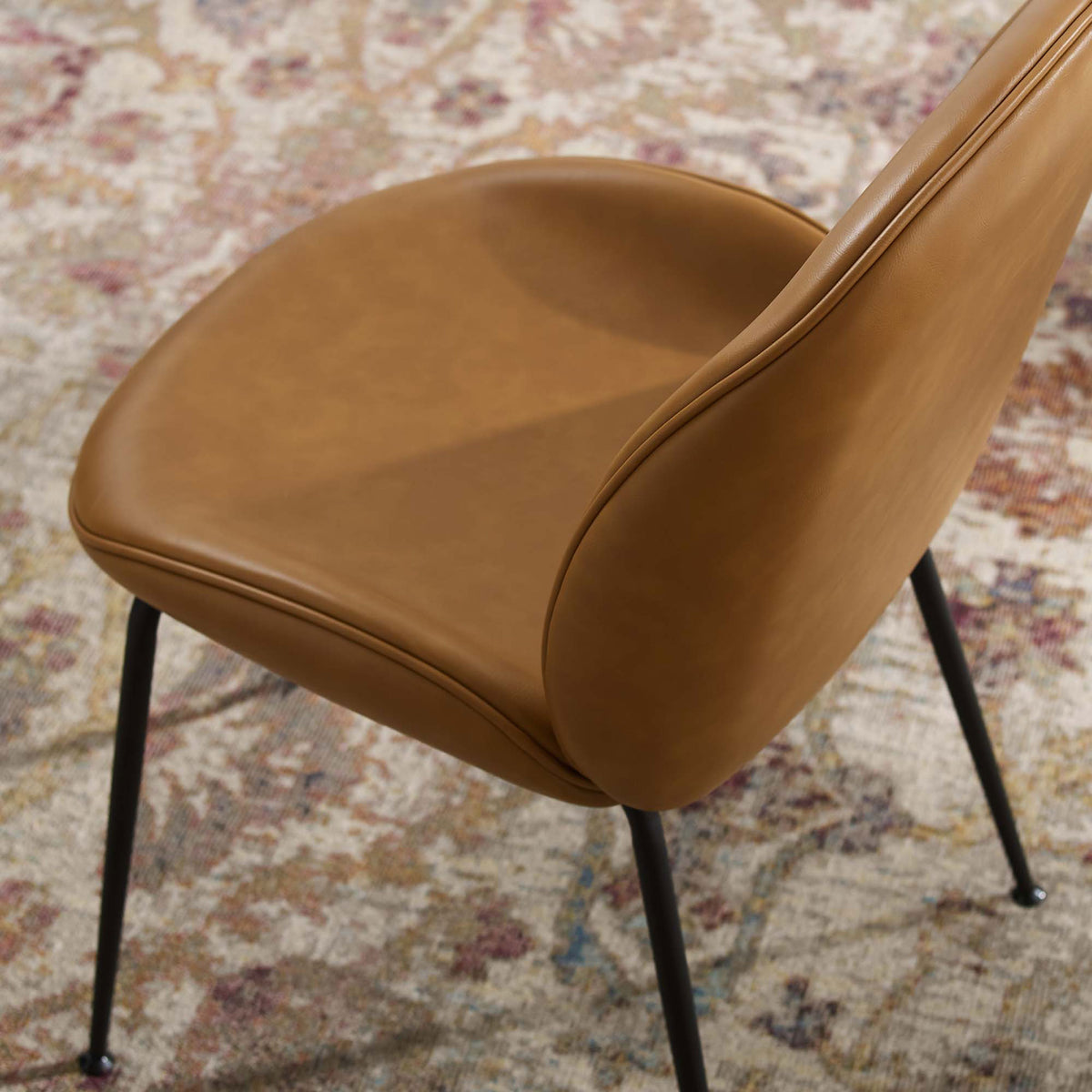 Tan vegan leather Scoop dining chair seat showcasing smooth upholstery and tailored piping || EEI-4636-TAN || detail_room